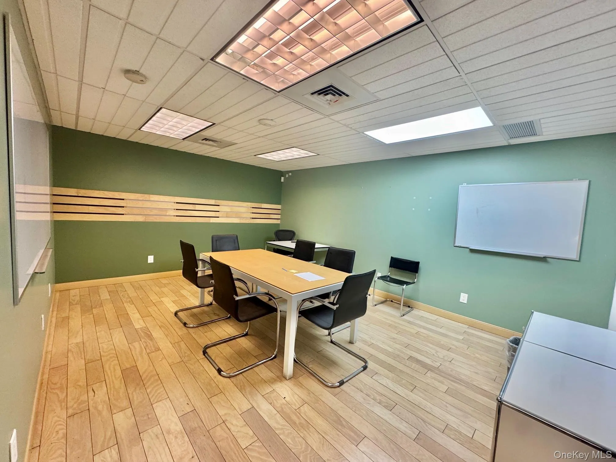 Dining room with wood finished floors and baseboards Dining room with wood finished floors and baseboards