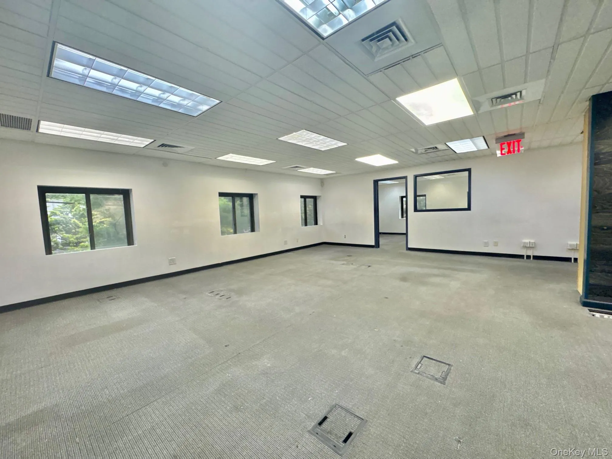 Empty room featuring baseboards and carpet Empty room featuring baseboards and carpet