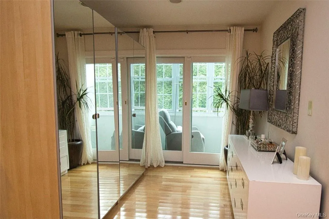 Dressing room with extra closets,wood flooring,sliders to sitting room Dressing room with extra closets,wood flooring,sliders to sitting room