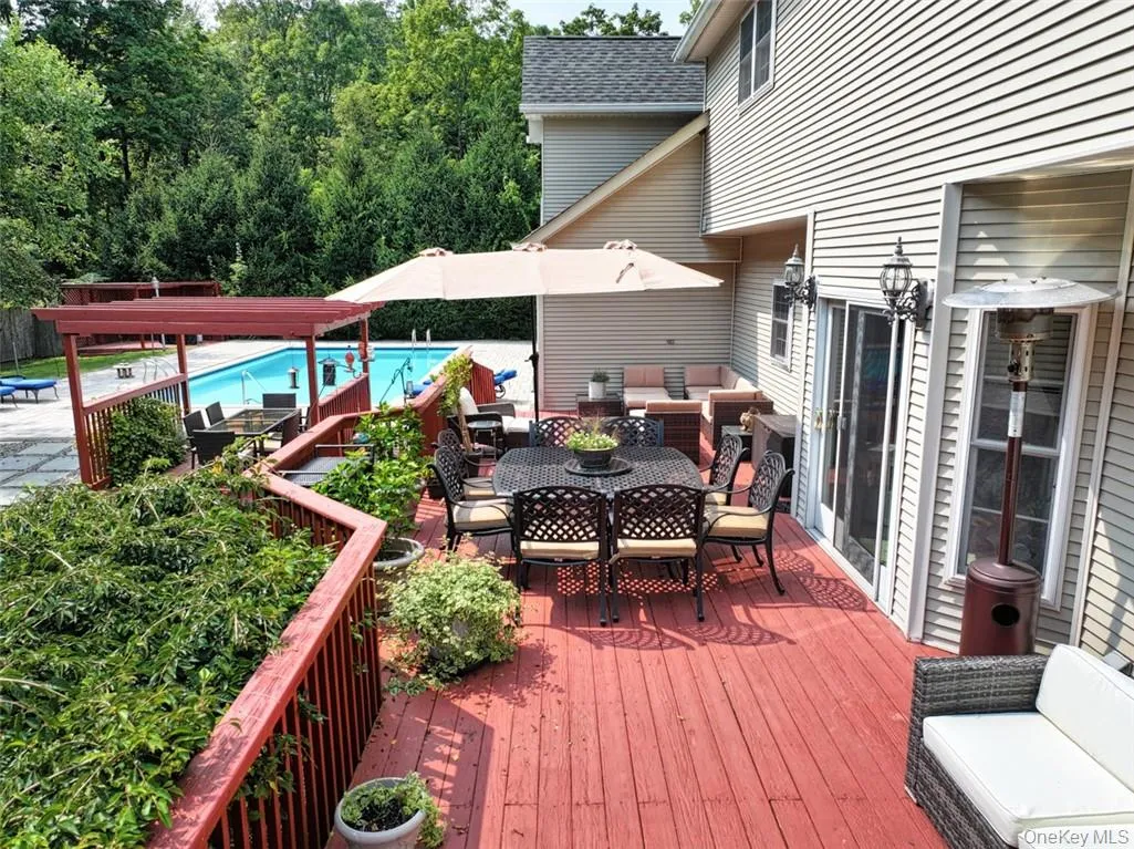 Extra large deck, accessed by 2 sets of sliders (1 set in Kitchen and 1 set in Family Room). Extra large deck, accessed by 2 sets of sliders (1 set in Kitchen and 1 set in Family Room).