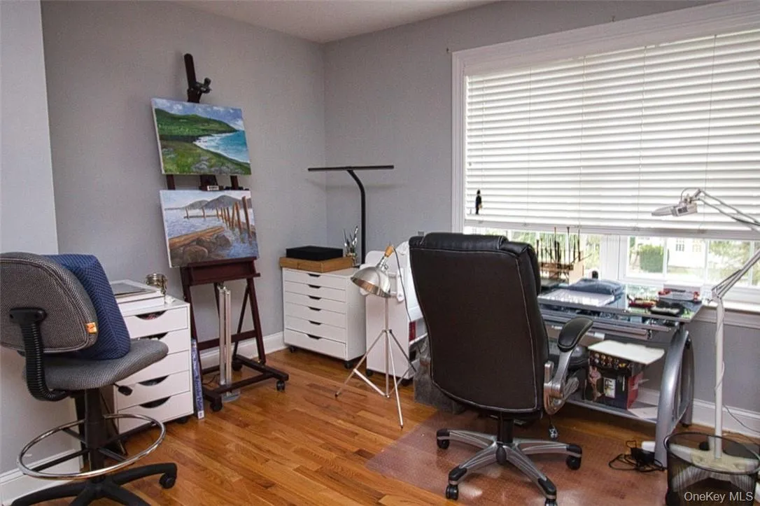 Large bedroom featuring hardwood / wood flooring, two closets, big window Large bedroom featuring hardwood / wood flooring, two closets, big window