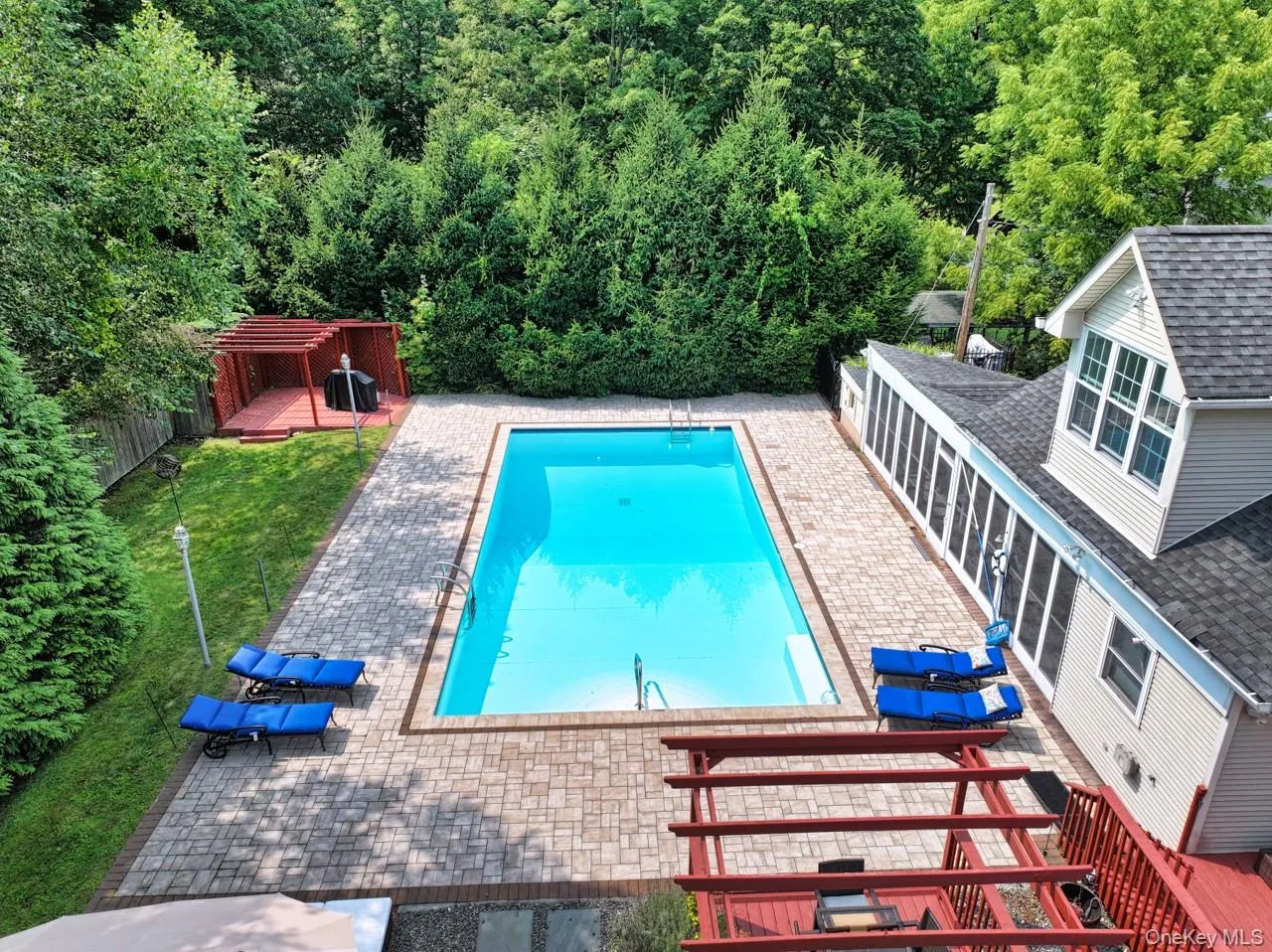 View of swimming pool featuring a patio area and a fenced backyard View of swimming pool featuring a patio area and a fenced backyard
