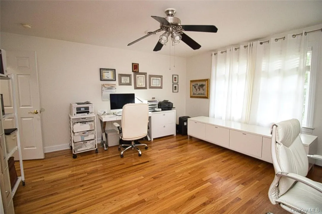 Very large Bedroom now used as a double-office, featuring ceiling fan, a wealth of natural light, wood flooring, and large double-door closet Very large Bedroom now used as a double-office, featuring ceiling fan, a wealth of natural light, wood flooring, and large double-door closet