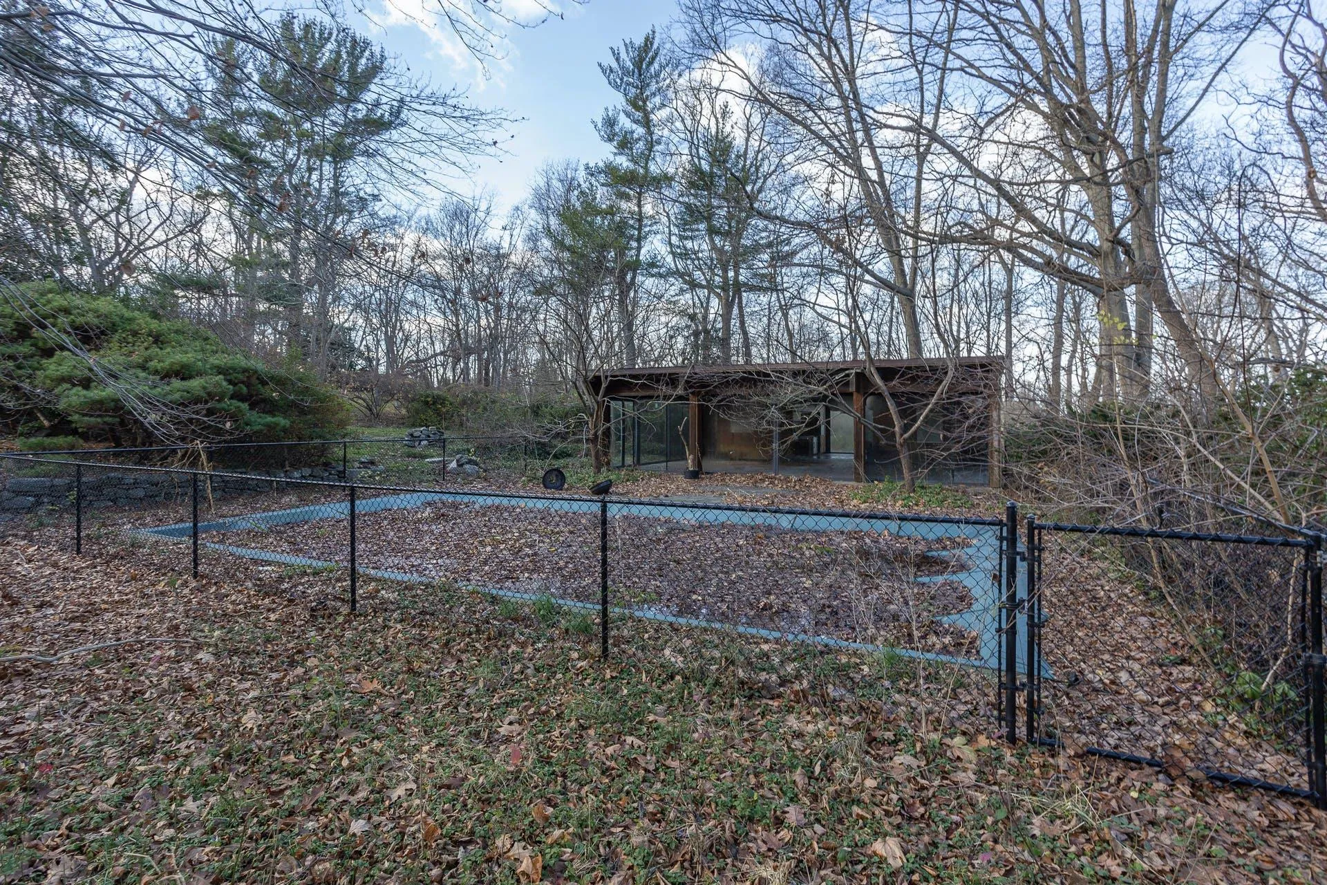View of yard featuring a gate and an outbuilding View of yard featuring a gate and an outbuilding