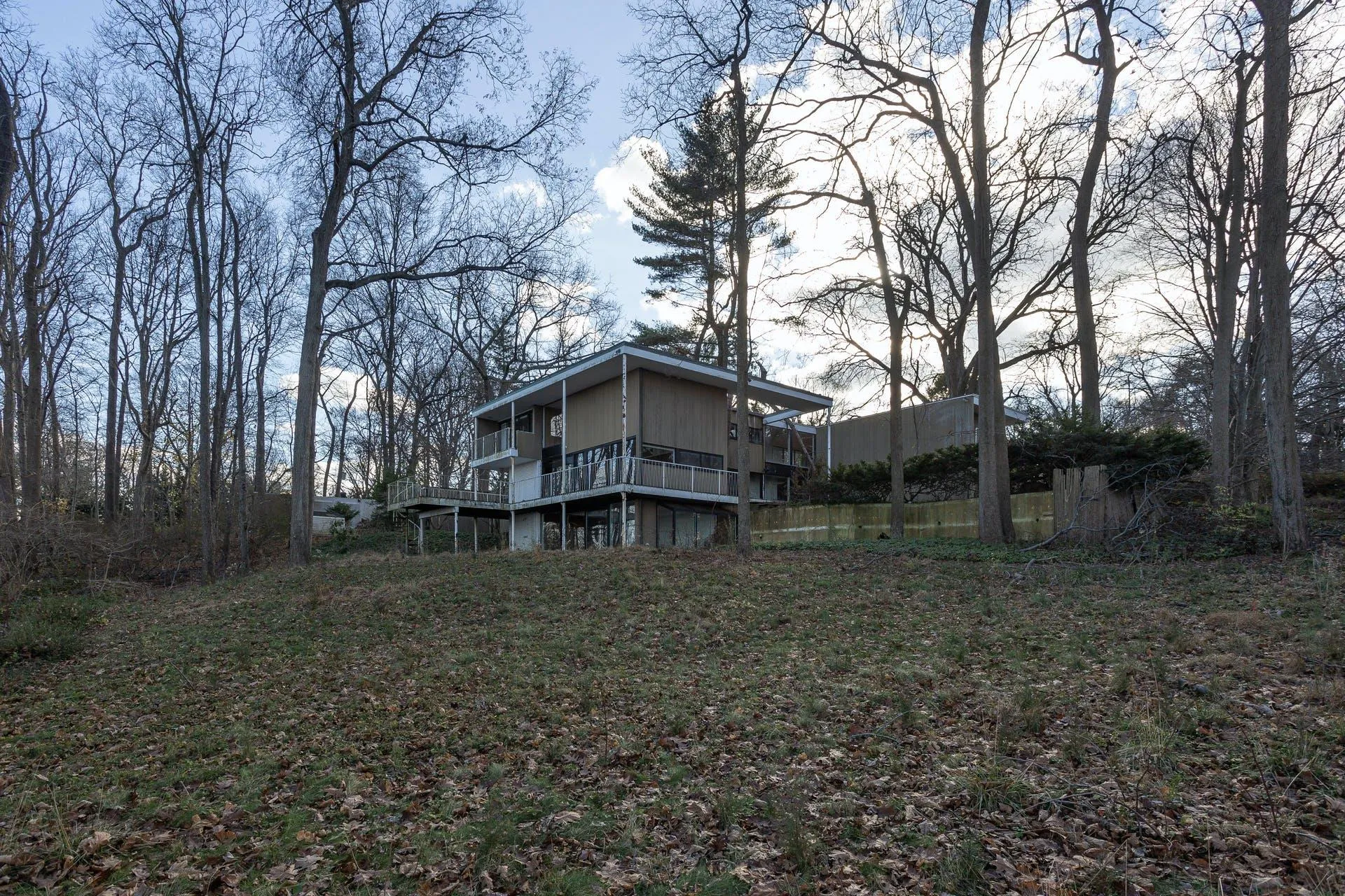 Back of property featuring a wooden deck Back of property featuring a wooden deck