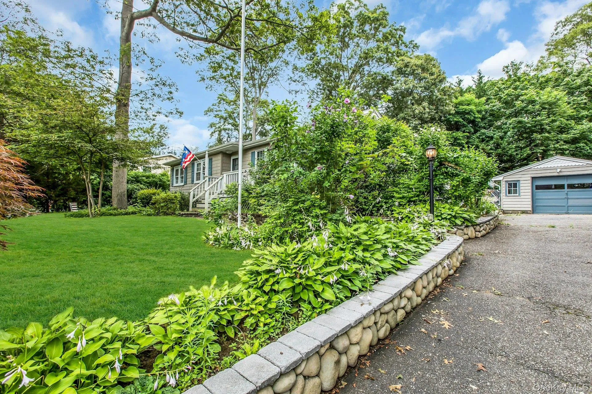 Detached Garage and Stone Lined Multi-Car Paved Driveway Detached Garage and Stone Lined Multi-Car Paved Driveway