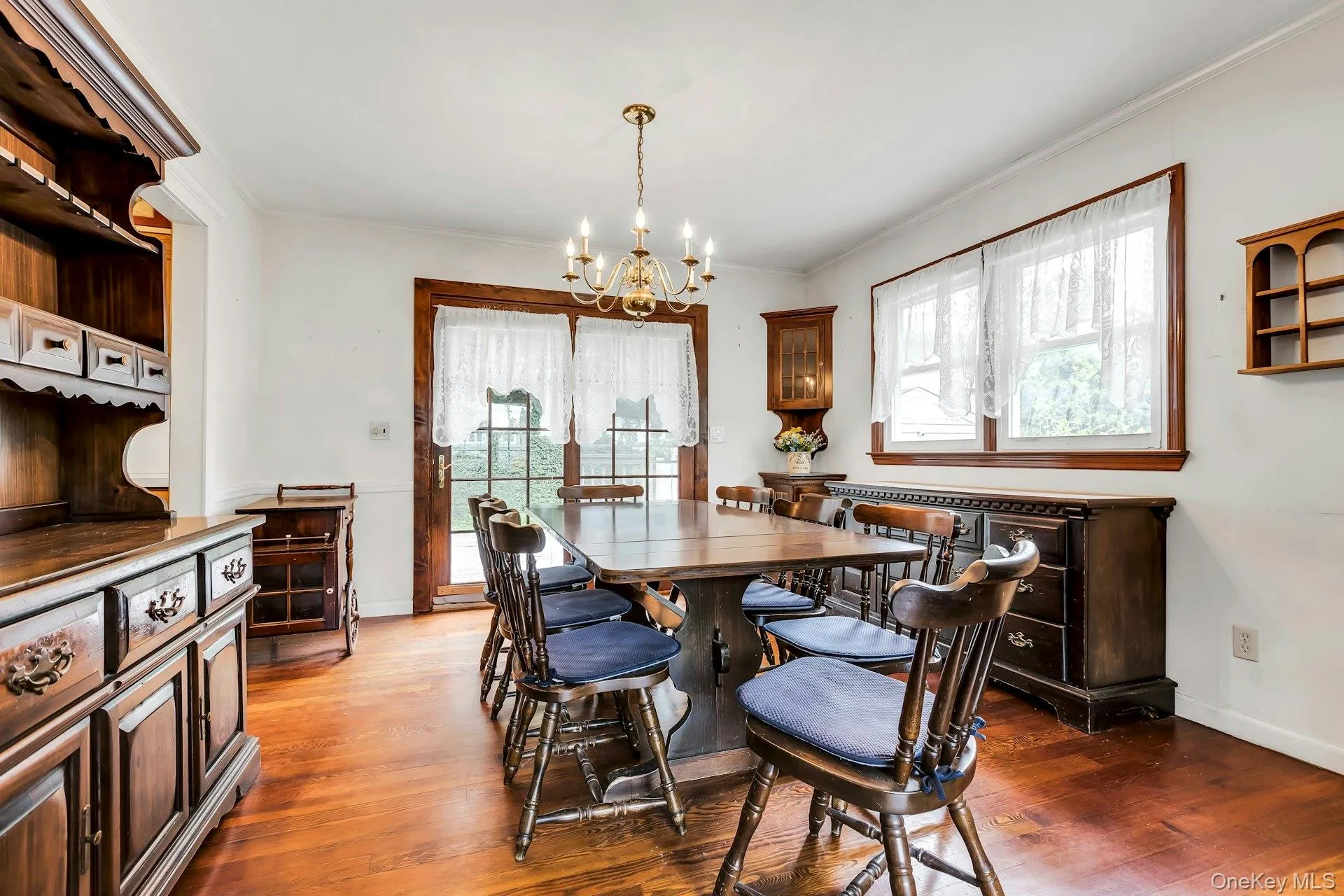 Formal Dining Room with Newly Refinished Hardwood Floors and Patio Doors out to Deck and Yard Formal Dining Room with Newly Refinished Hardwood Floors and Patio Doors out to Deck and Yard