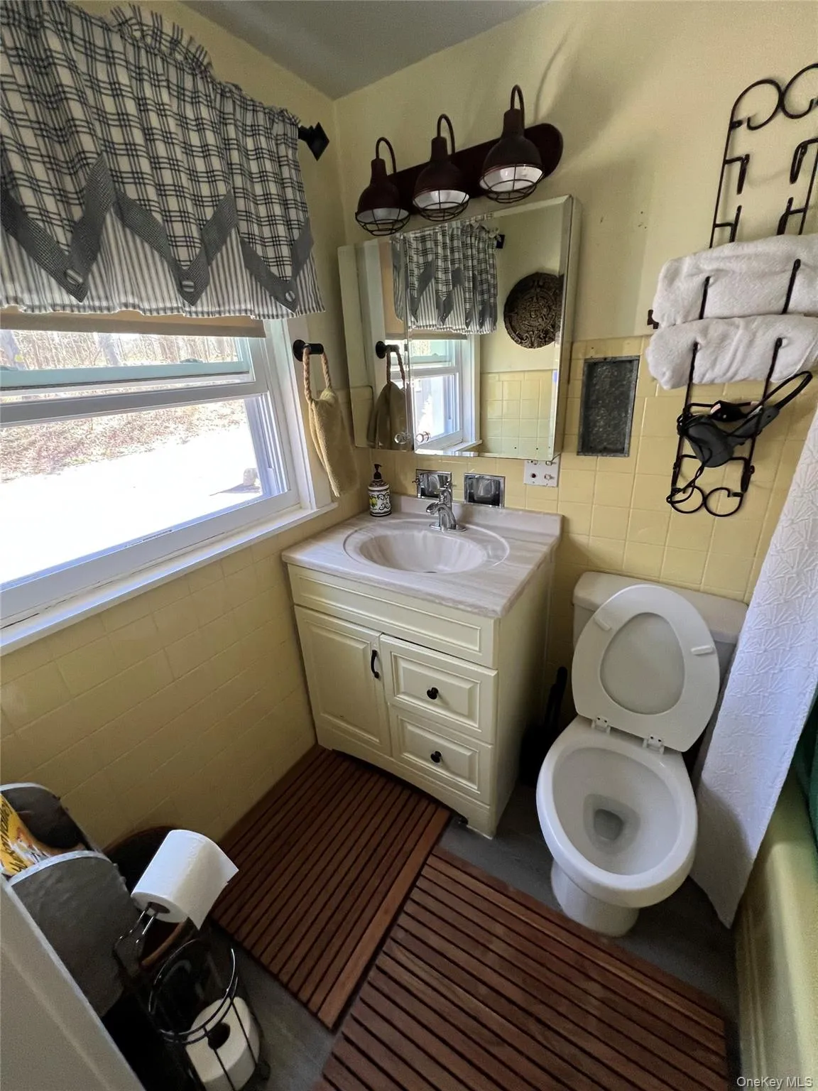 Bathroom with tile walls and vanity Bathroom with tile walls and vanity