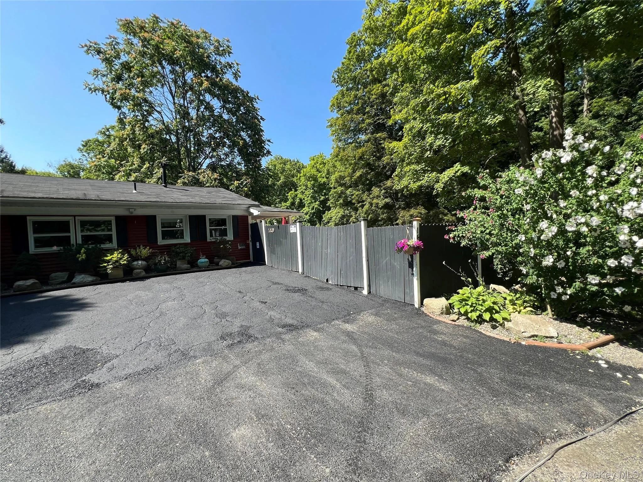View of side of property with driveway View of side of property with driveway