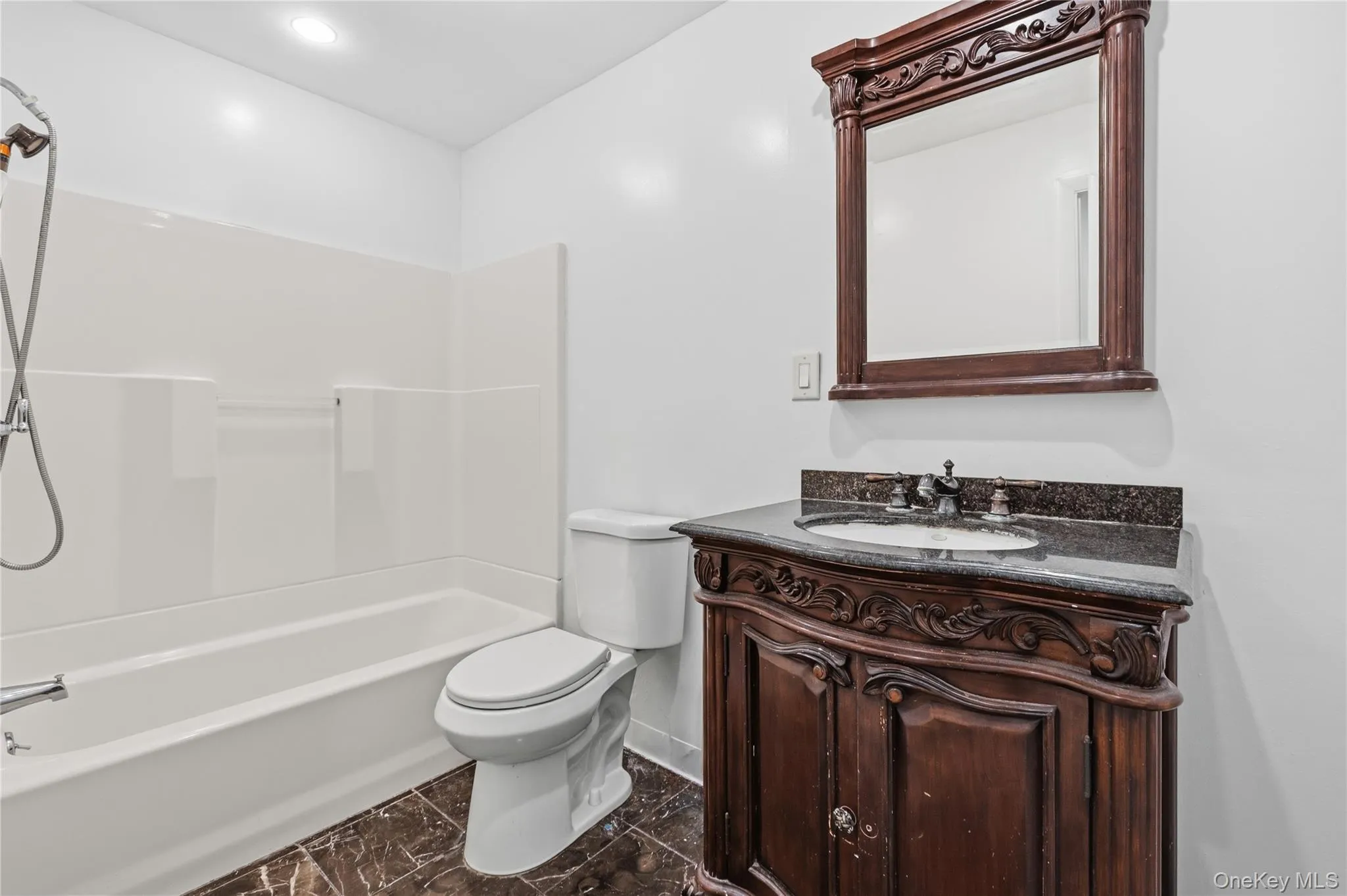 Bathroom with shower/tub combo Bathroom with shower/tub combo