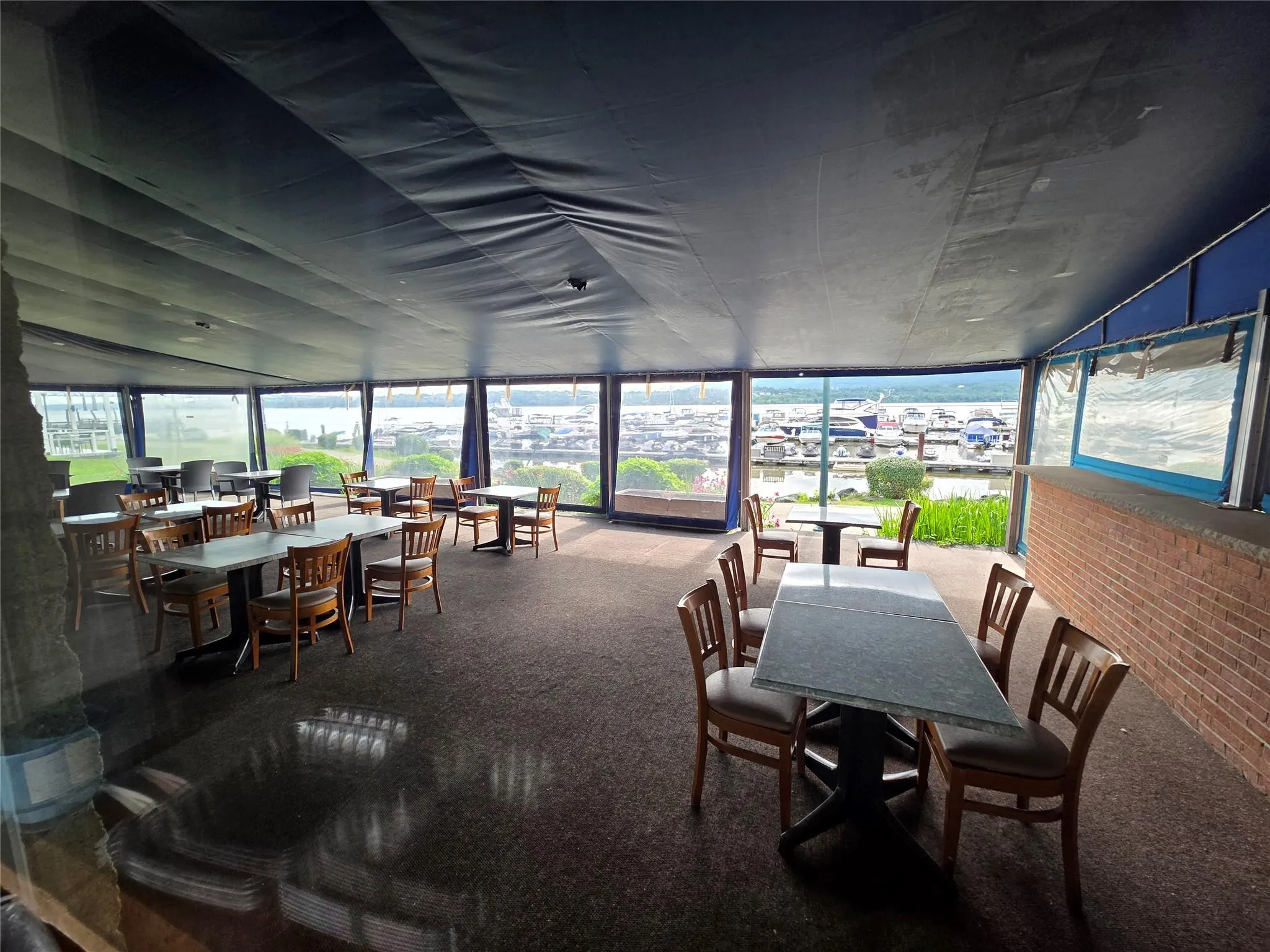 Sunroom / solarium with carpet flooring and floor to ceiling windows Sunroom / solarium with carpet flooring and floor to ceiling windows