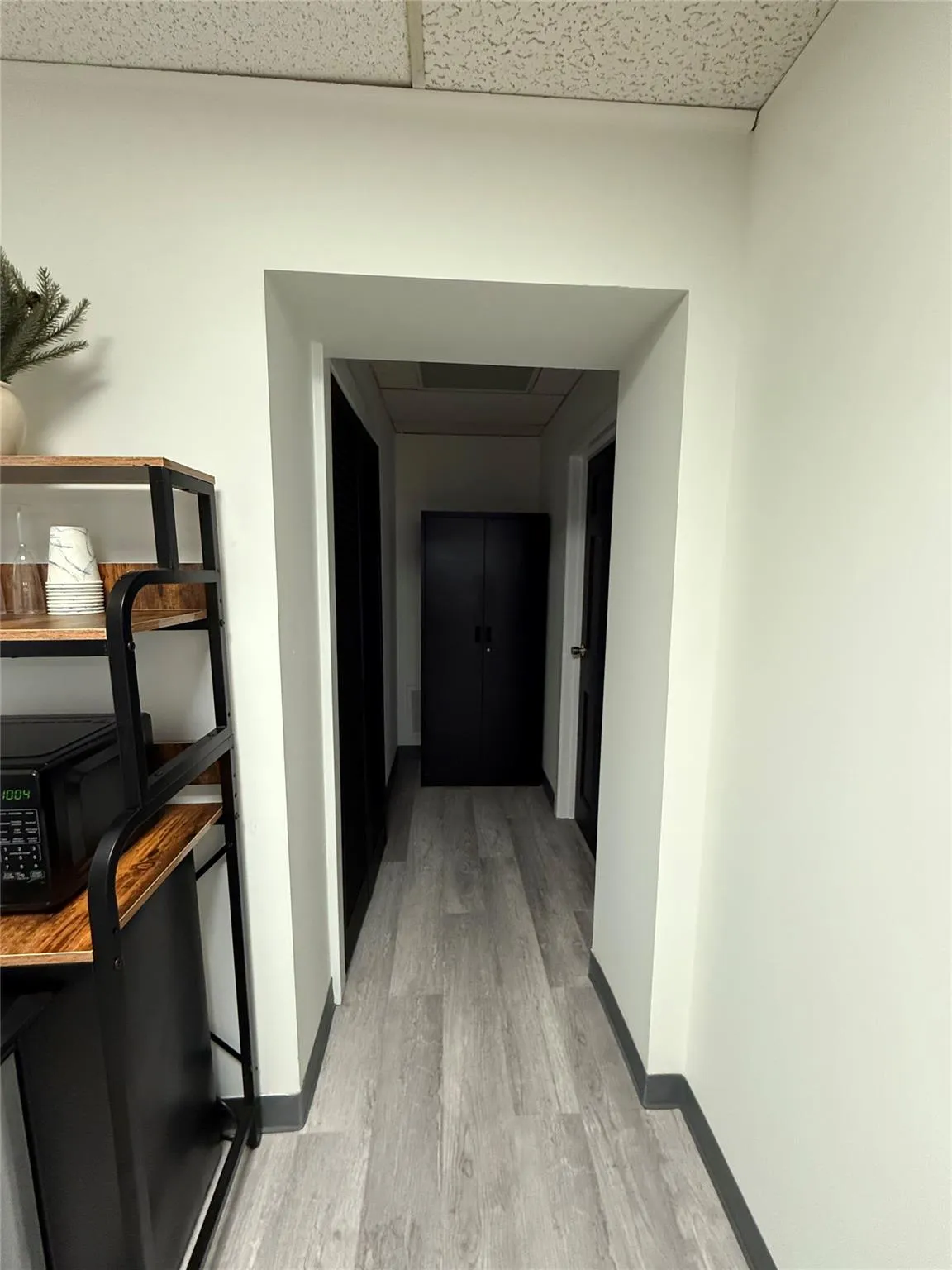 Hall with light wood-style floors and baseboards Hall with light wood-style floors and baseboards