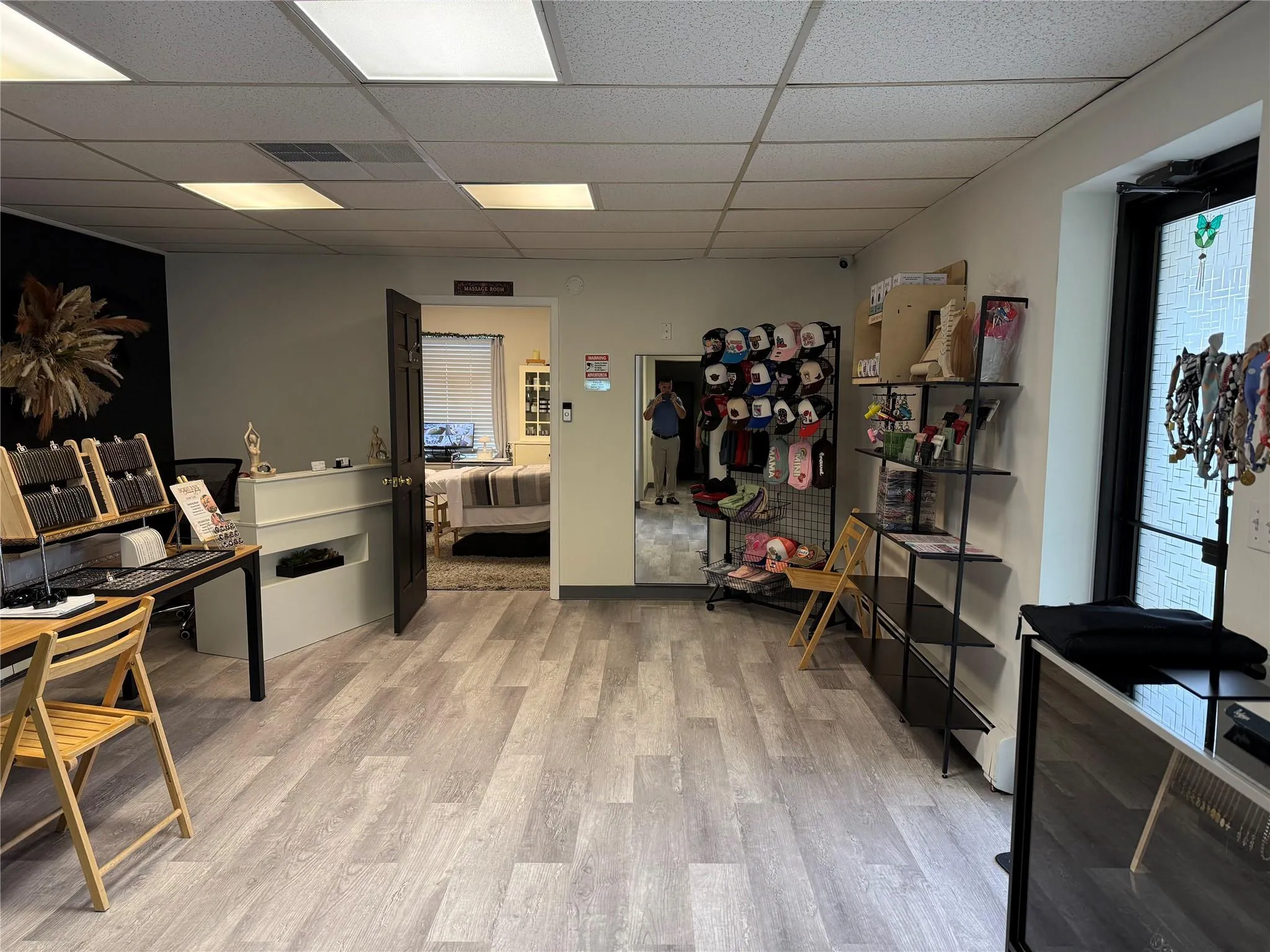 Office with a paneled ceiling and light wood-style flooring Office with a paneled ceiling and light wood-style flooring