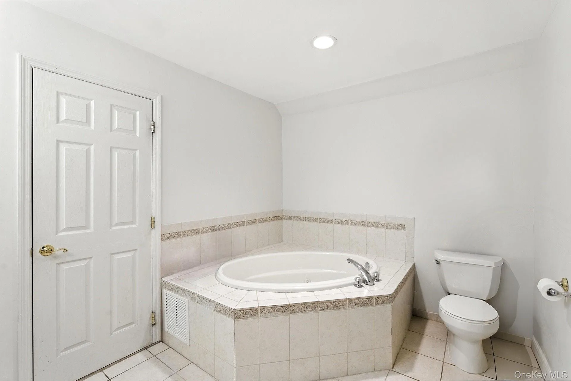 Primary bathroom featuring a jacuzzi tub. Primary bathroom featuring a jacuzzi tub.