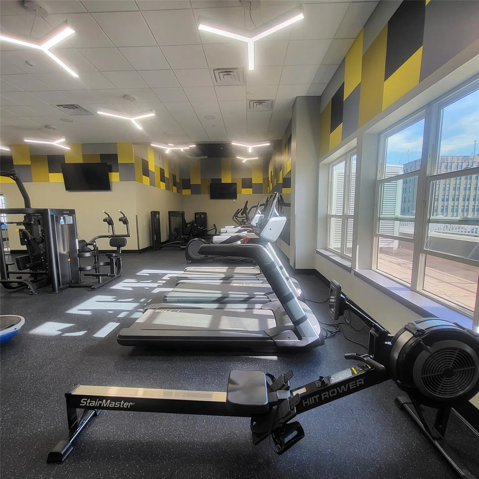 Exercise room with a paneled ceiling Exercise room with a paneled ceiling