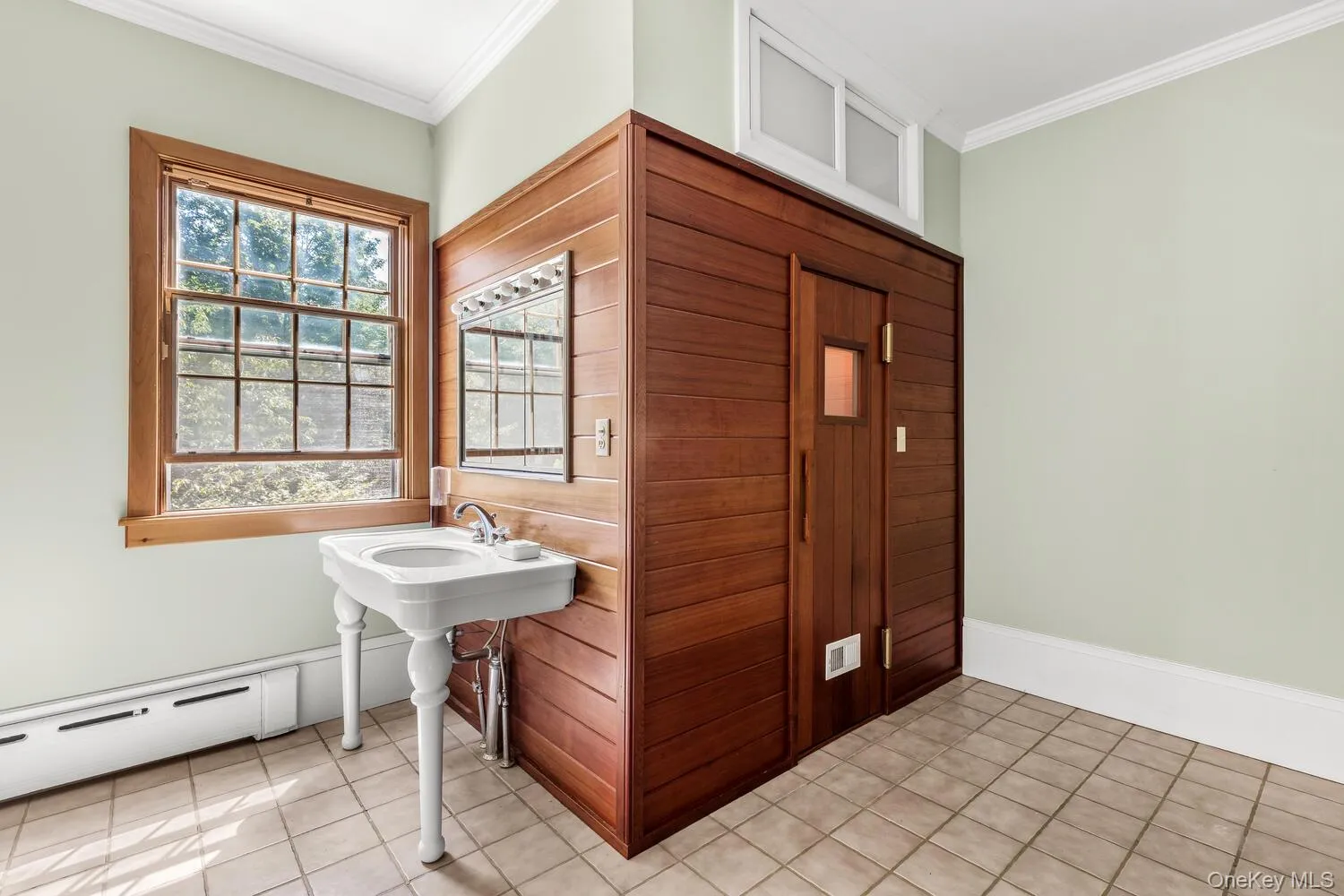 There is a sauna opposite the shower stall There is a sauna opposite the shower stall