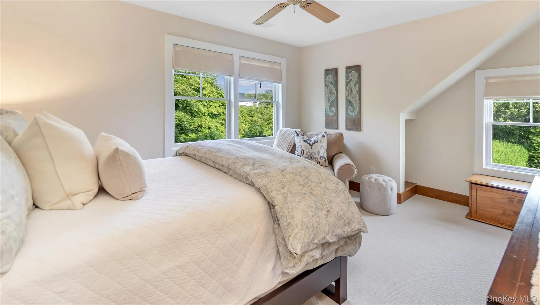 Bedroom with carpet and a ceiling fan Bedroom with carpet and a ceiling fan