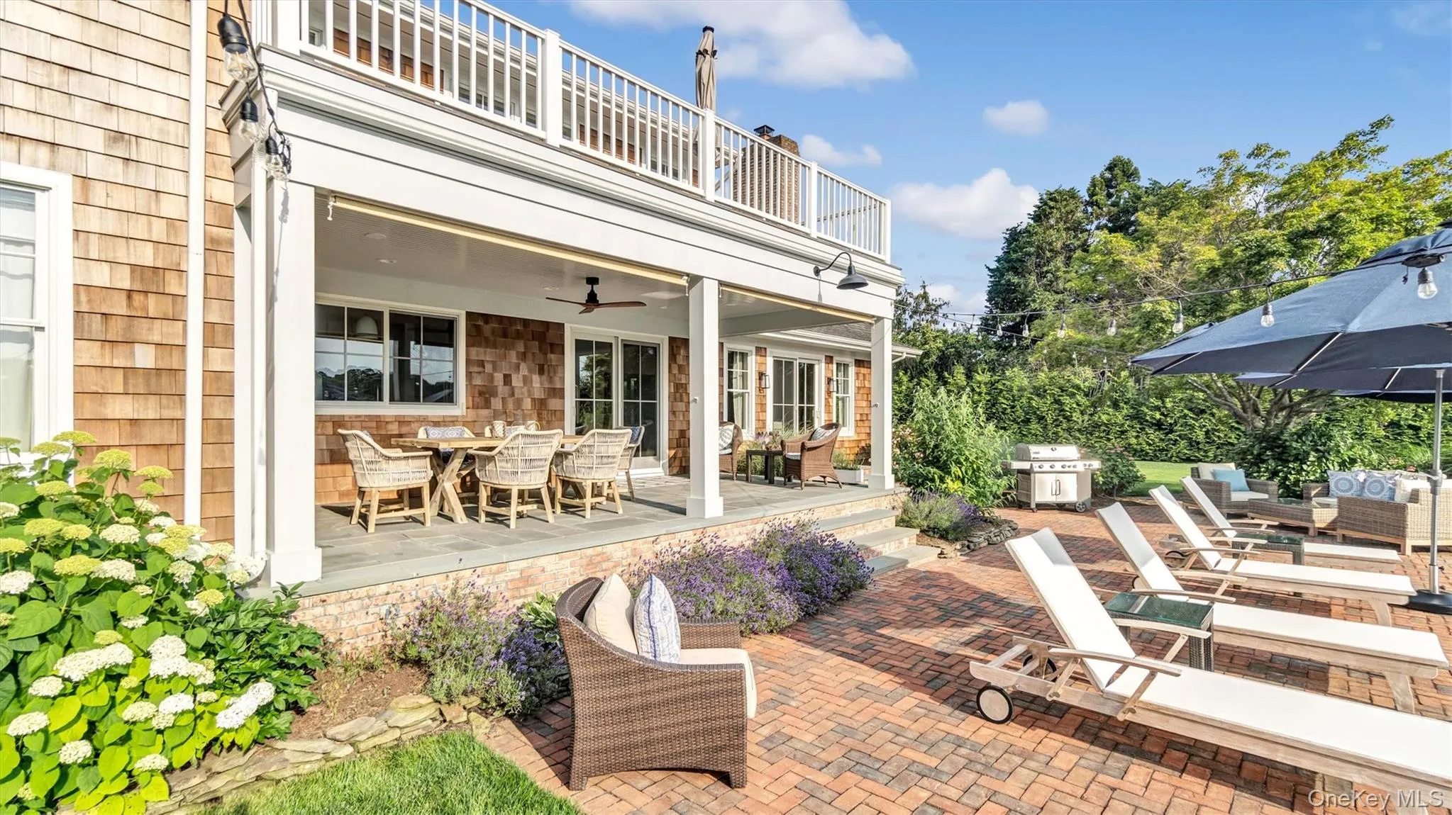 Patio / terrace with outdoor dining area, a ceiling fan, a patio area, an outdoor living space, and area for grilling Patio / terrace with outdoor dining area, a ceiling fan, a patio area, an outdoor living space, and area for grilling