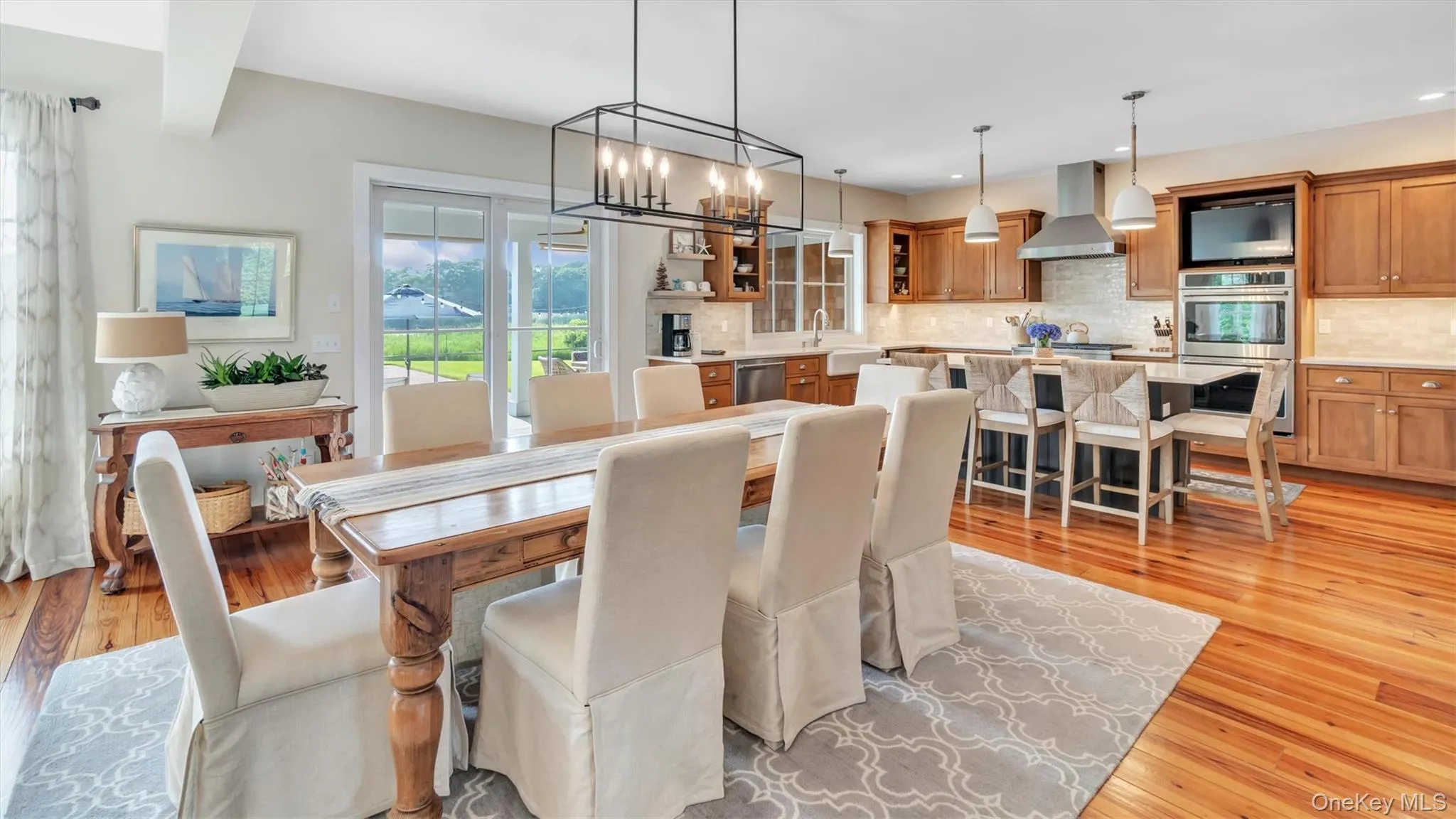 Dining room featuring light wood-style flooring, a chandelier, and recessed lighting Dining room featuring light wood-style flooring, a chandelier, and recessed lighting