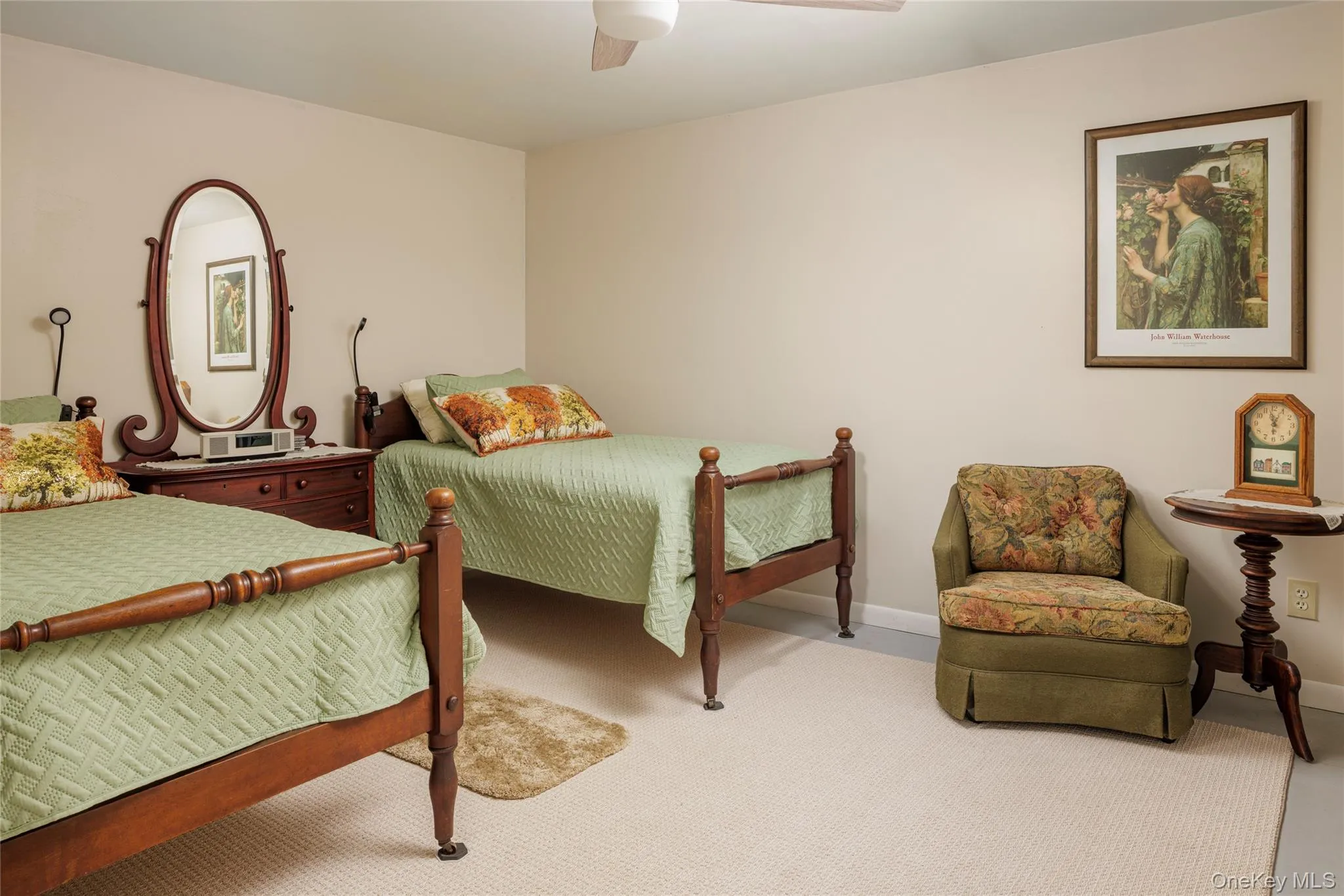 Carpeted bedroom featuring ceiling fan and baseboards Carpeted bedroom featuring ceiling fan and baseboards