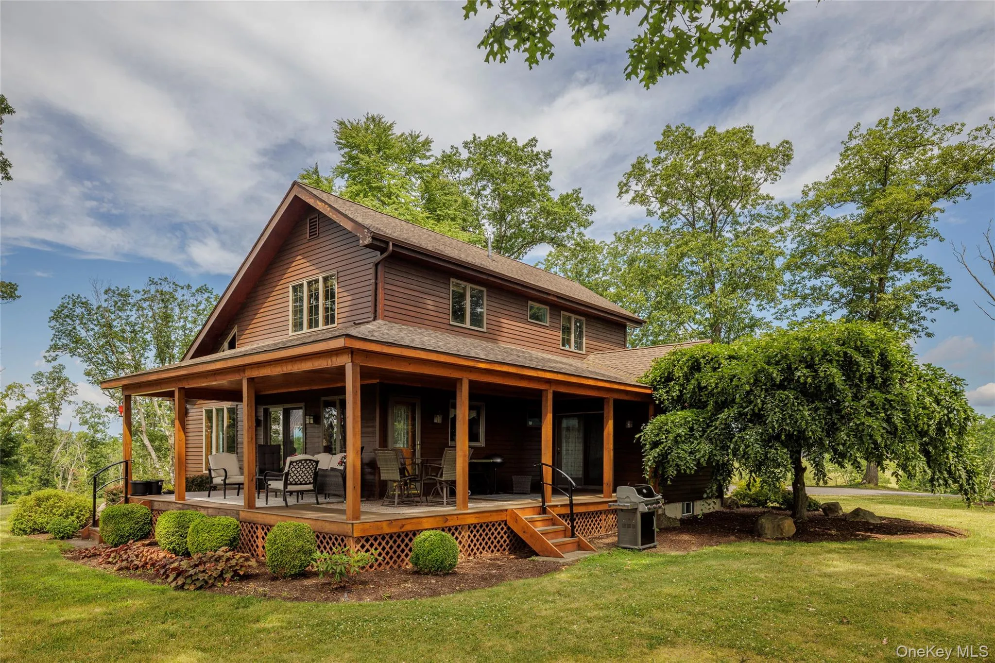 Rear view of property featuring a shingled roof and a yard Rear view of property featuring a shingled roof and a yard