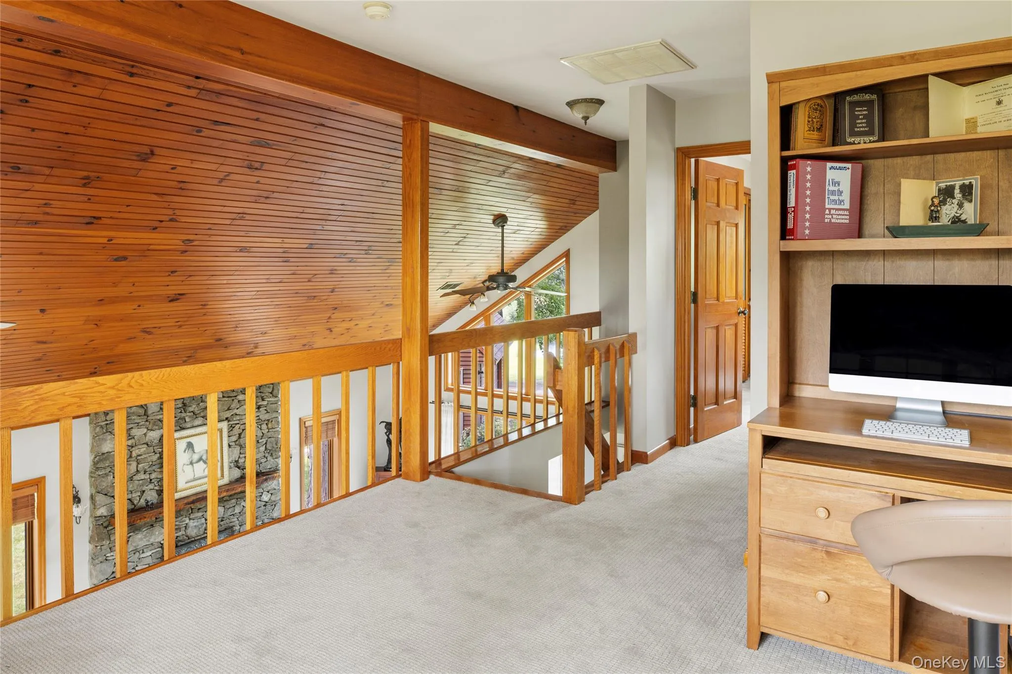 Home office featuring carpet flooring and ceiling fan Home office featuring carpet flooring and ceiling fan