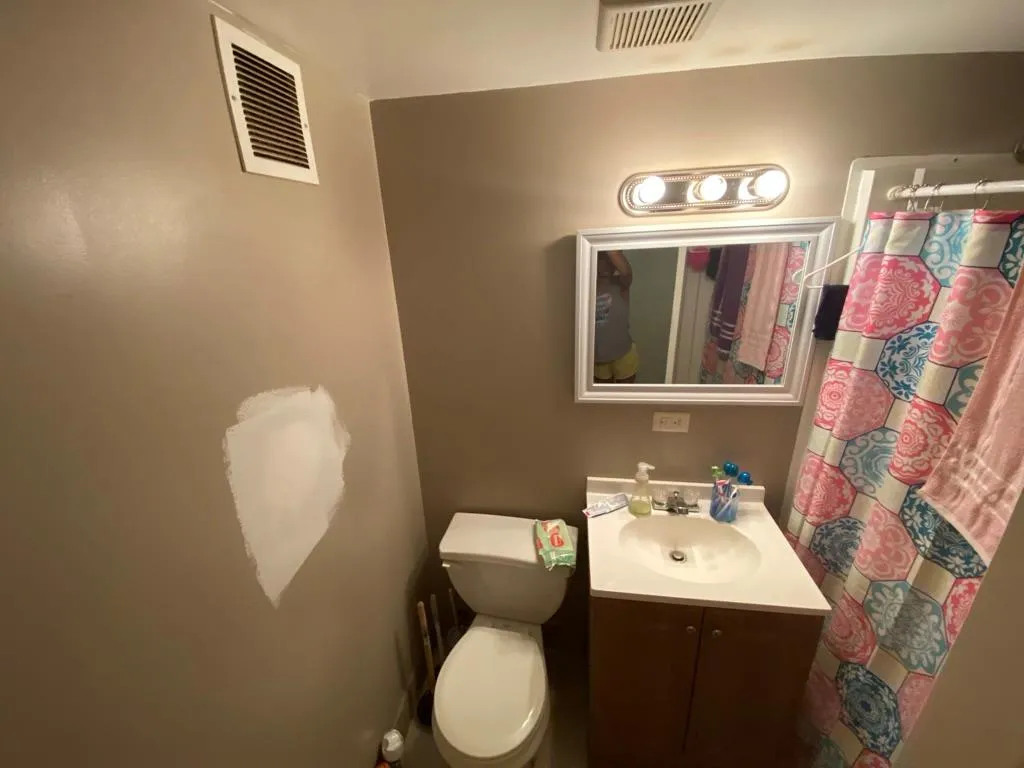 Full bath with vanity and a shower with shower curtain Full bath with vanity and a shower with shower curtain