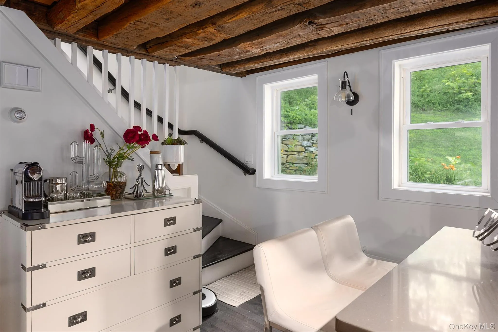 Sitting room featuring stairway and dark wood-style flooring Sitting room featuring stairway and dark wood-style flooring