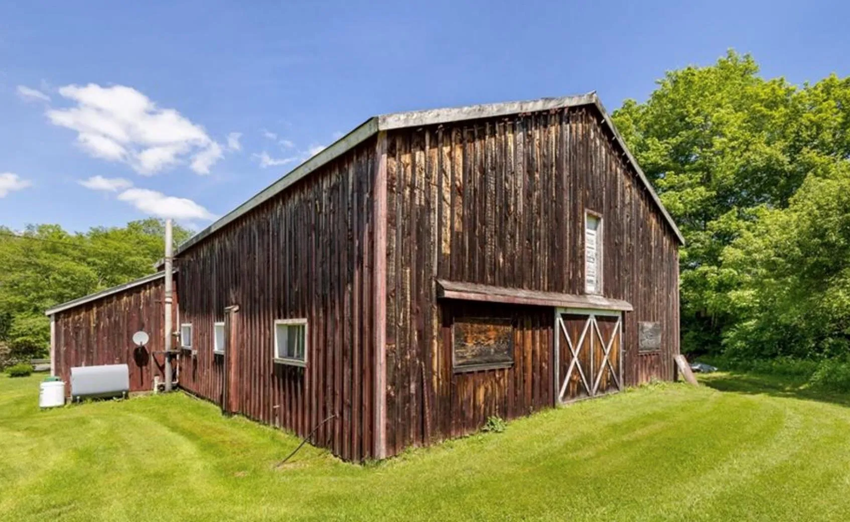 View of barn featuring a yard View of barn featuring a yard