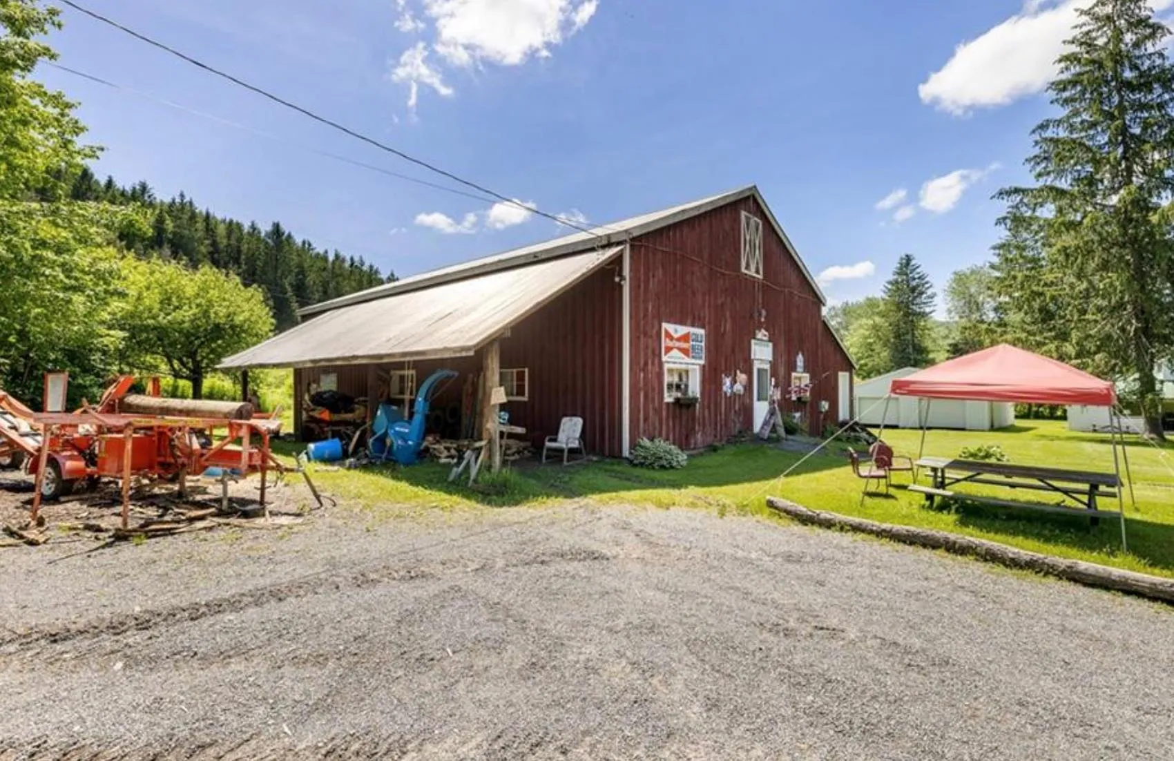 View of home's exterior featuring a lawn, an outbuilding, and an outdoor structure View of home's exterior featuring a lawn, an outbuilding, and an outdoor structure