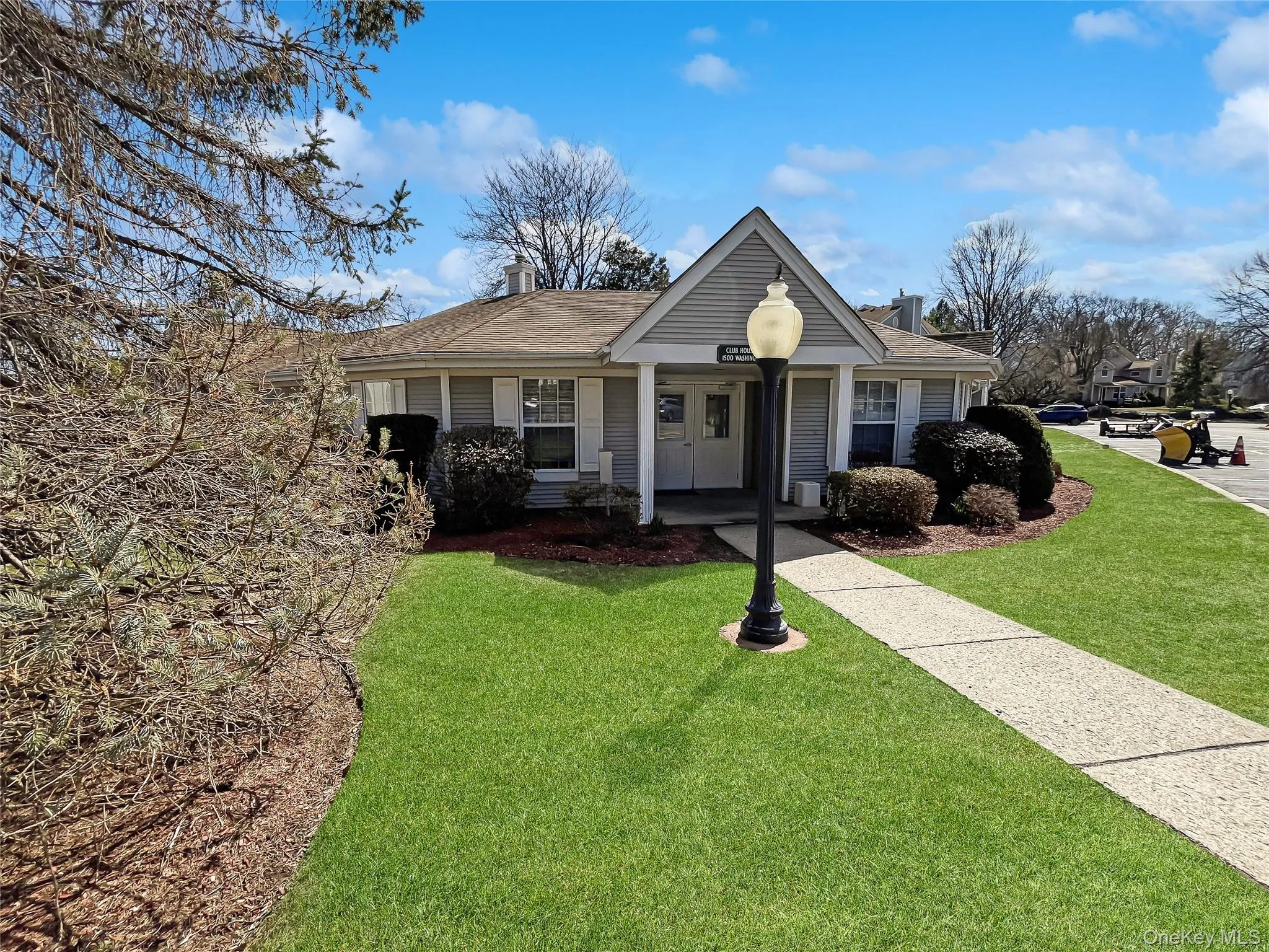 View of front facade featuring a front yard, a chimney, and roof with shingles View of front facade featuring a front yard, a chimney, and roof with shingles