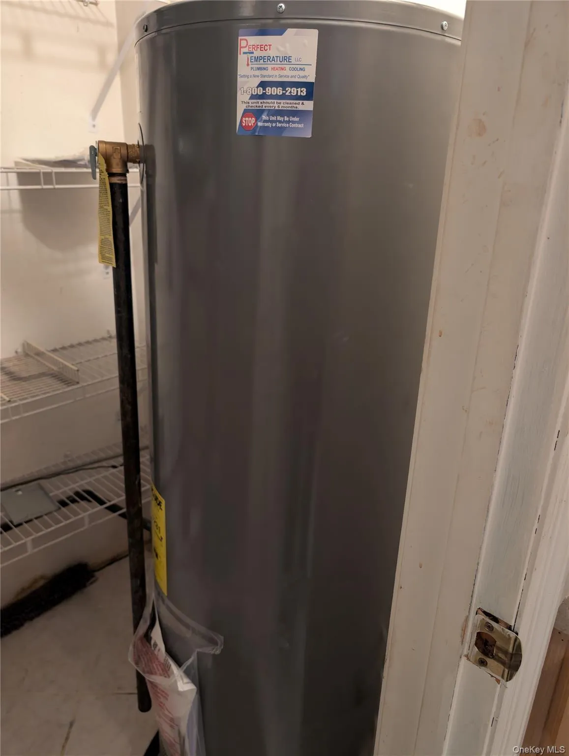 Utility room featuring water heater Utility room featuring water heater