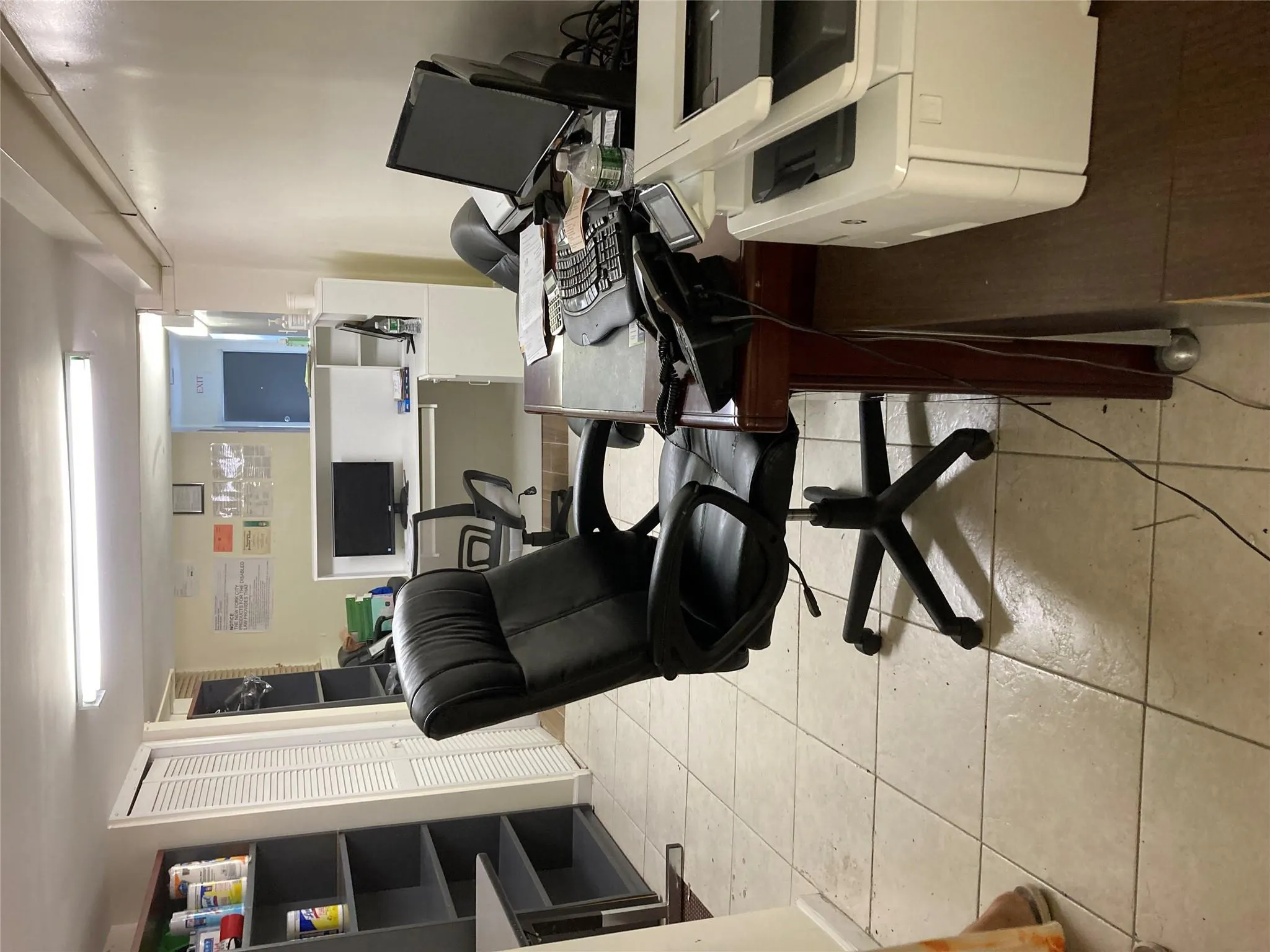 Office area with light tile patterned floors Office area with light tile patterned floors