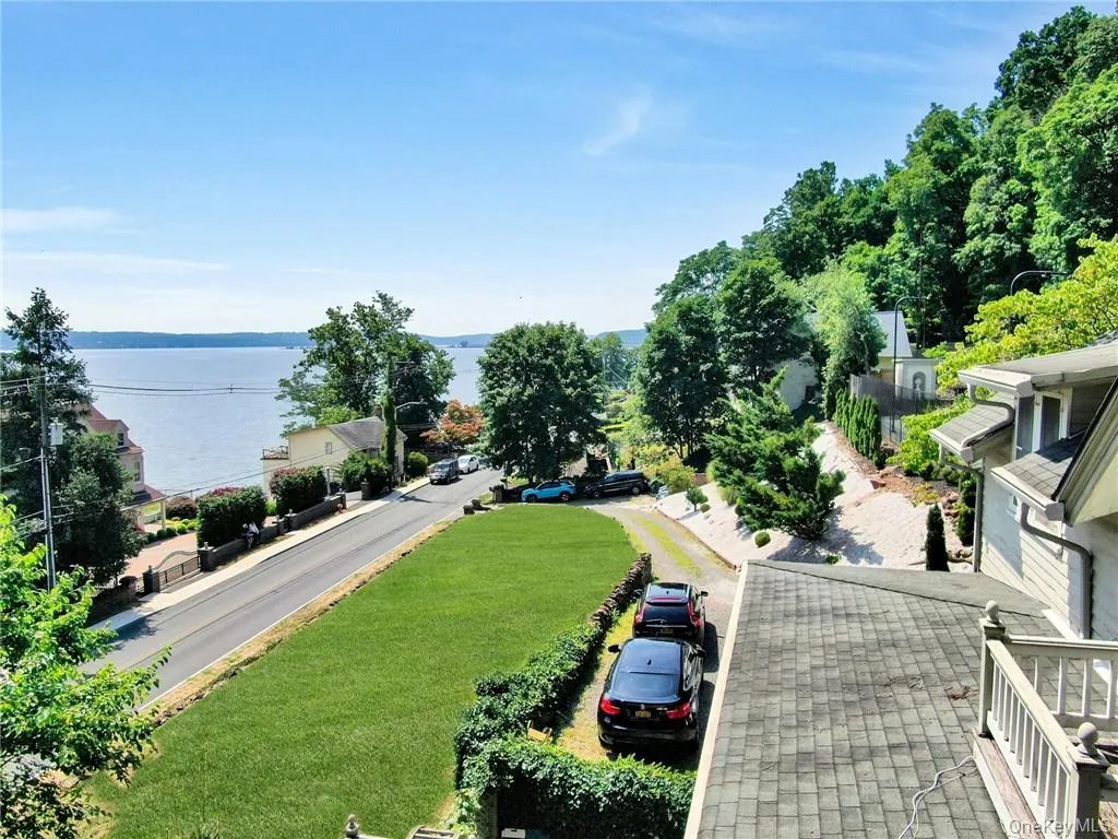 Birds eye view of property featuring a water view Birds eye view of property featuring a water view