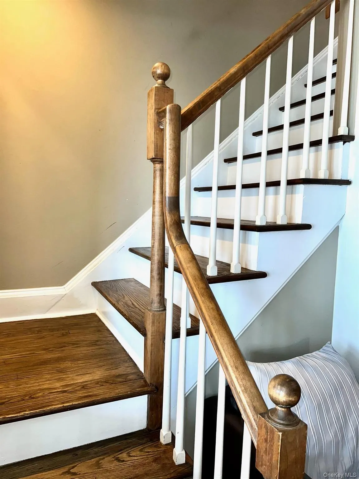 Staircase featuring wood-type flooring Staircase featuring wood-type flooring