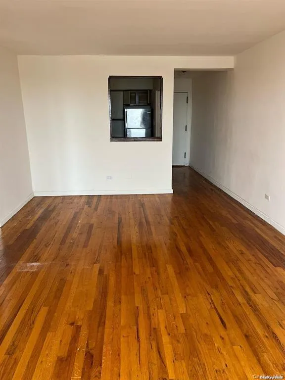 Unfurnished room with wood-type flooring Unfurnished room with wood-type flooring