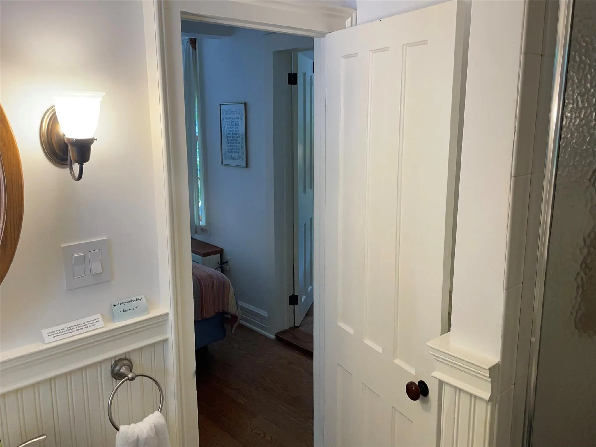 Hallway featuring dark wood-style flooring Hallway featuring dark wood-style flooring