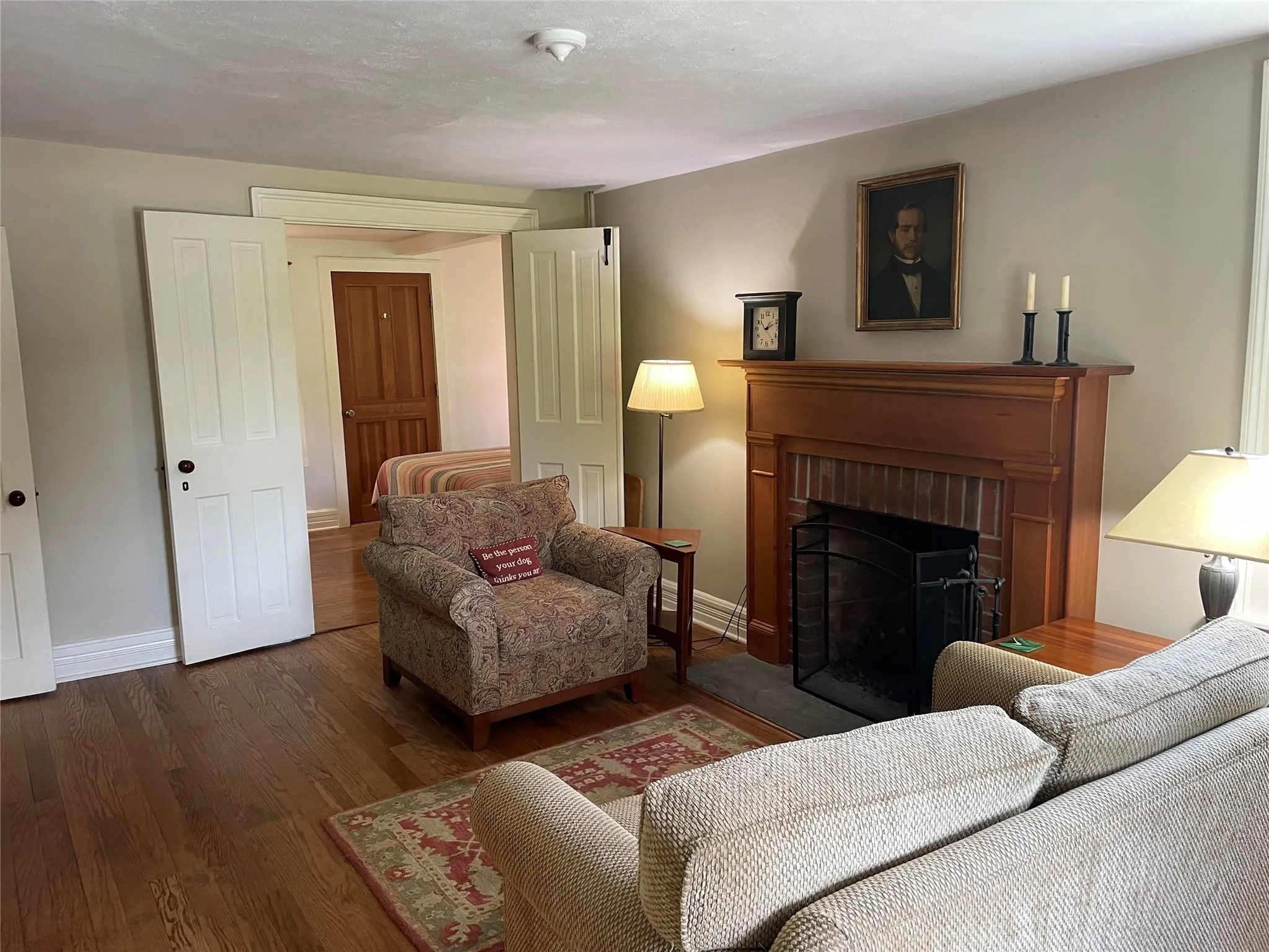 Living area featuring wood finished floors and a fireplace Living area featuring wood finished floors and a fireplace