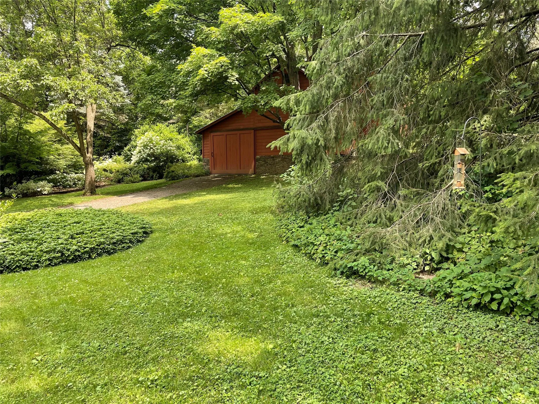 View of grassy yard featuring an outdoor structure View of grassy yard featuring an outdoor structure