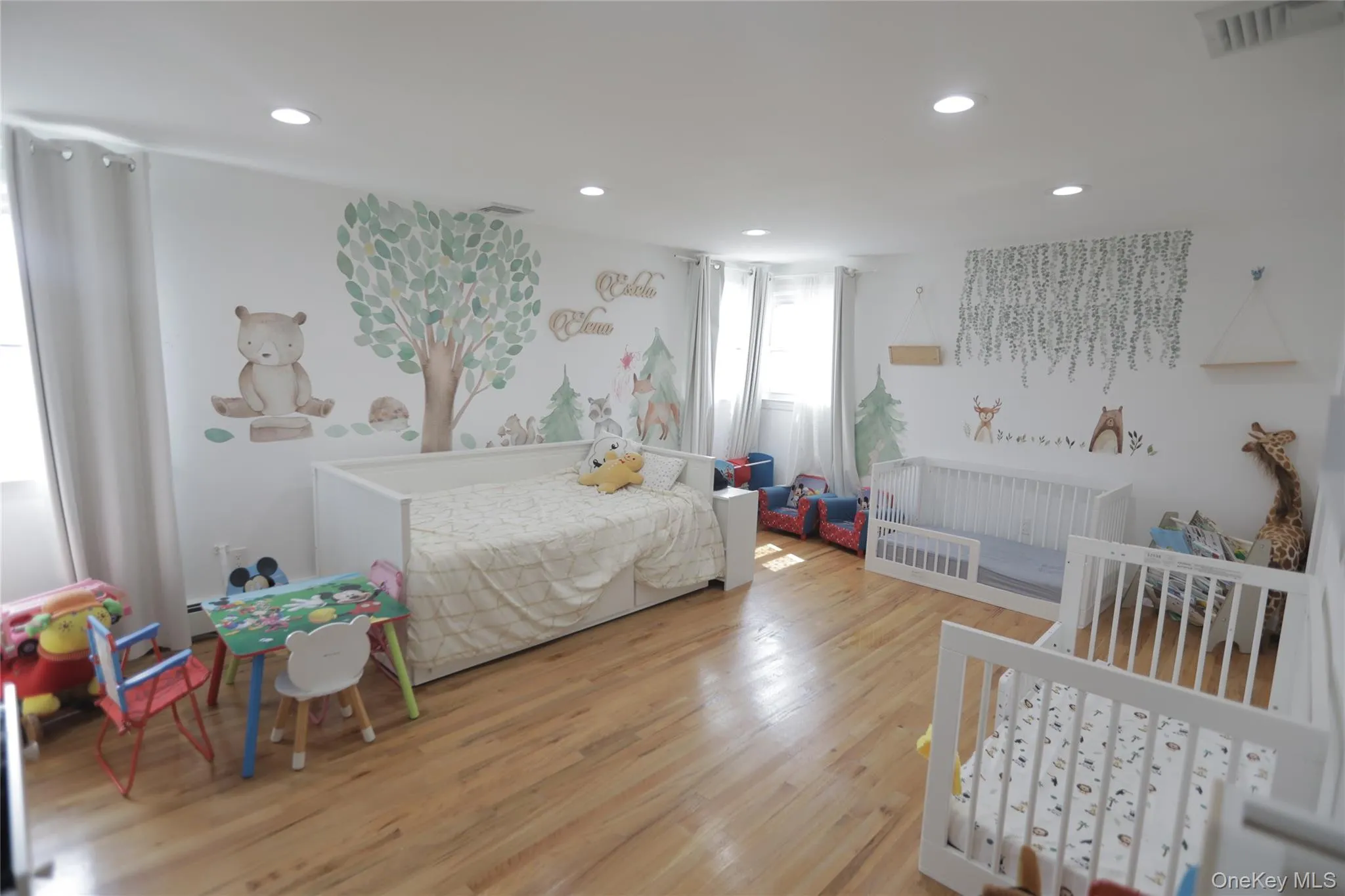 Bedroom with wood finished floors and recessed lighting Bedroom with wood finished floors and recessed lighting