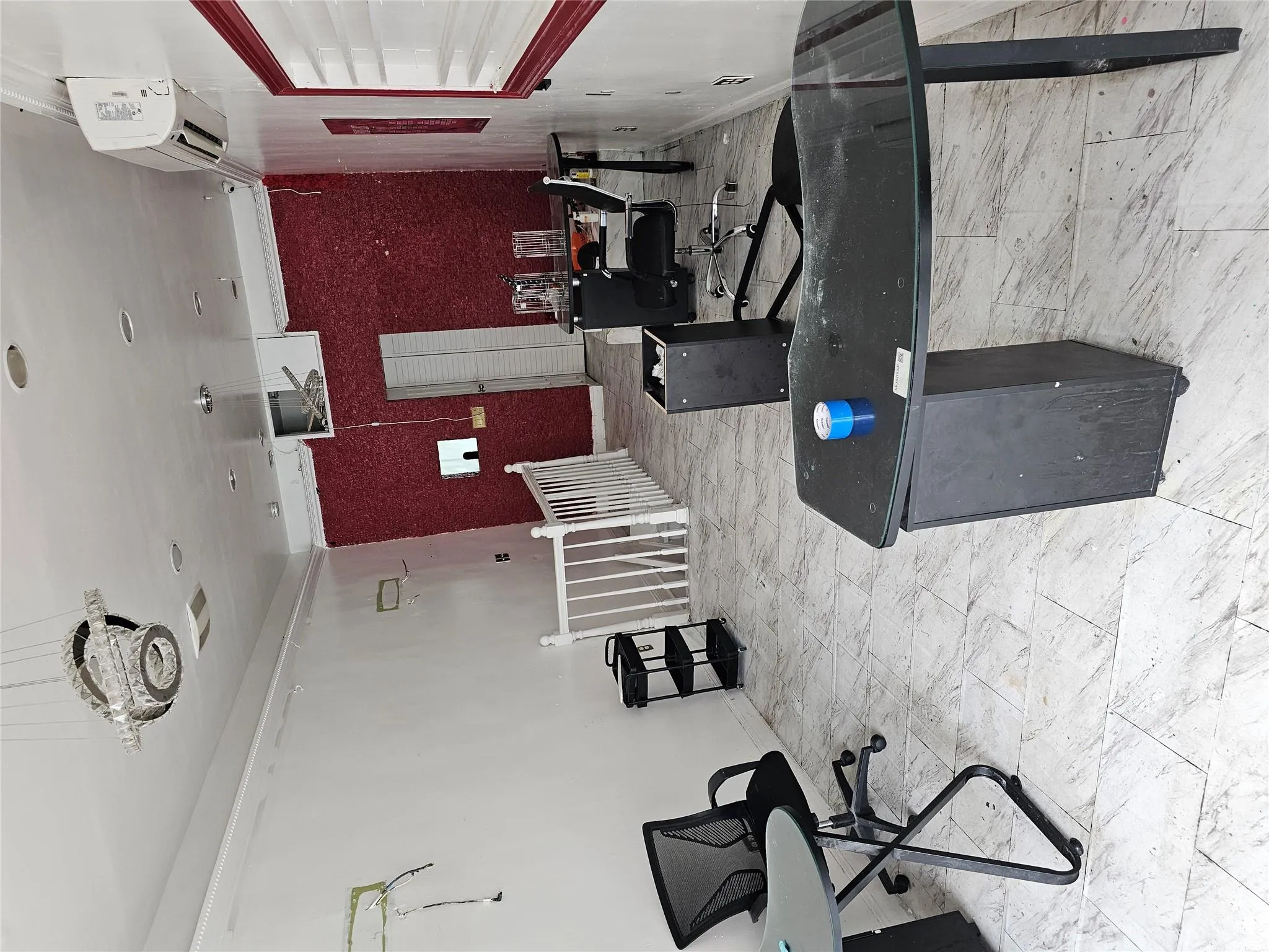 Office area featuring a wall unit AC Office area featuring a wall unit AC