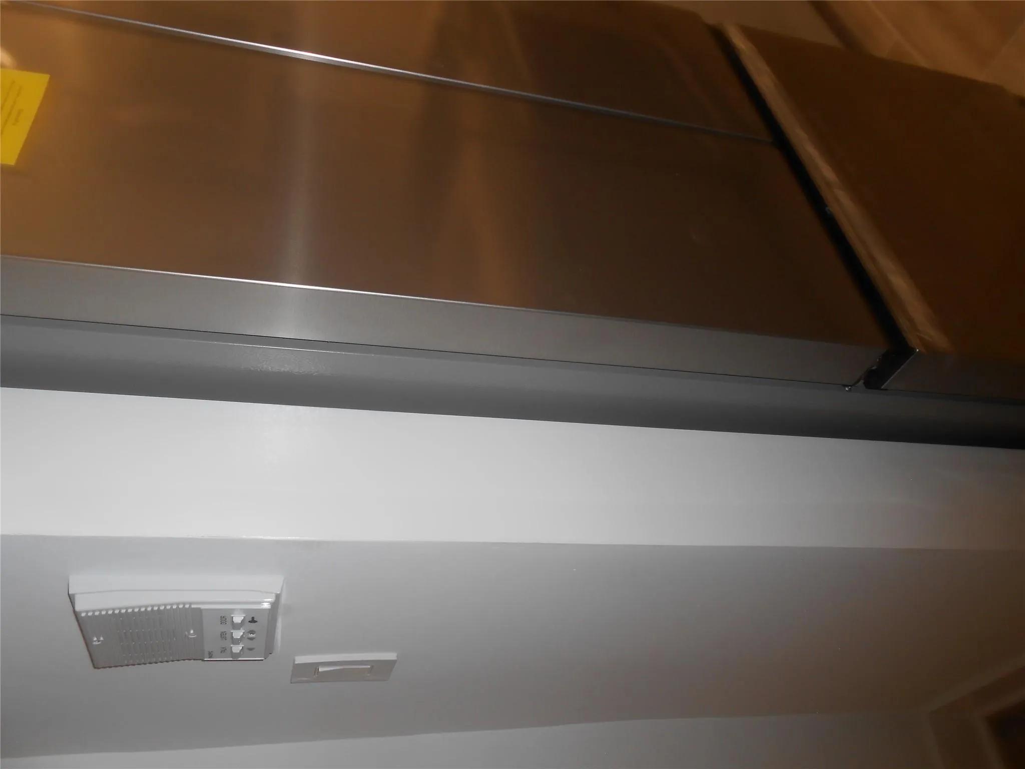 Detailed view of refrigerator and elevator Detailed view of refrigerator and elevator