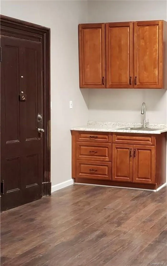 Kitchen with dark hardwood / wood-style floors and sink Kitchen with dark hardwood / wood-style floors and sink