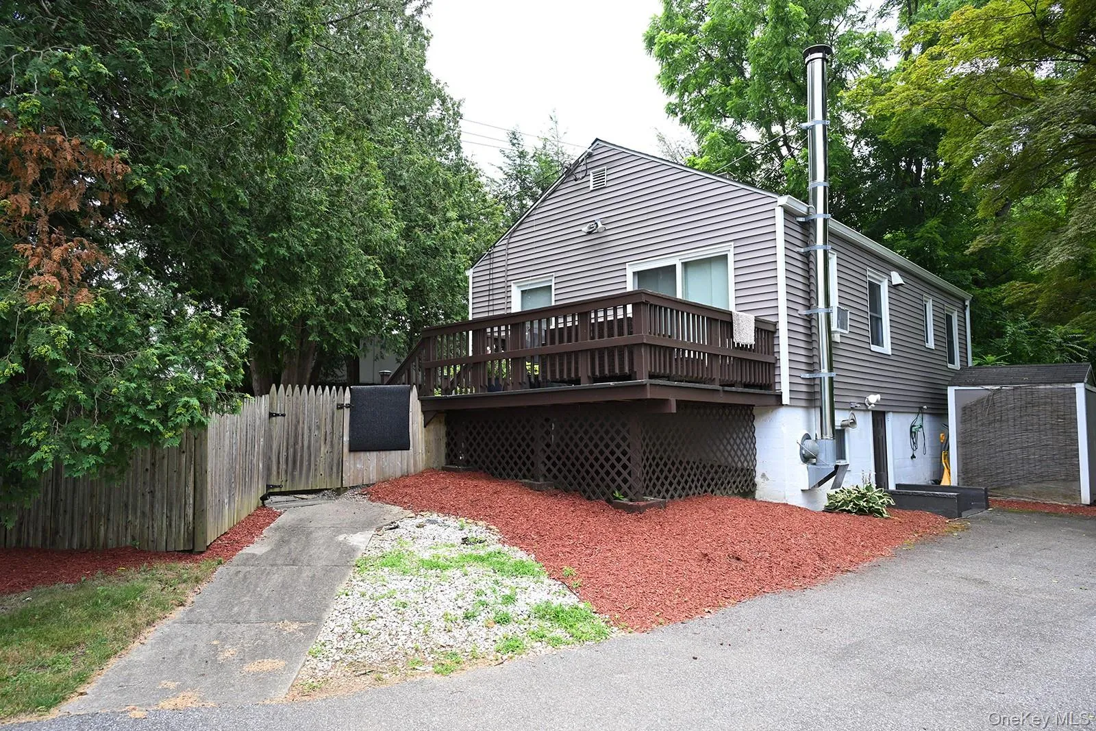 Back of house featuring a wooden deck Back of house featuring a wooden deck