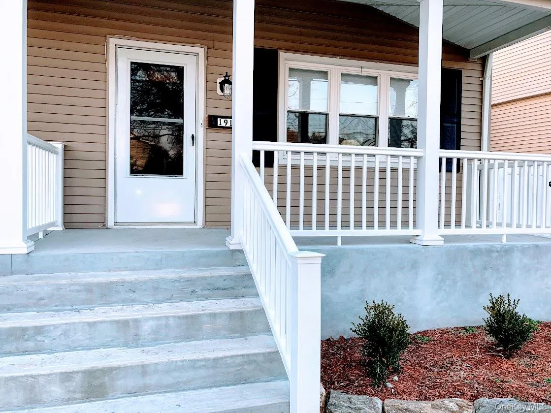 Doorway to front door featuring covered porch Doorway to front door featuring covered porch