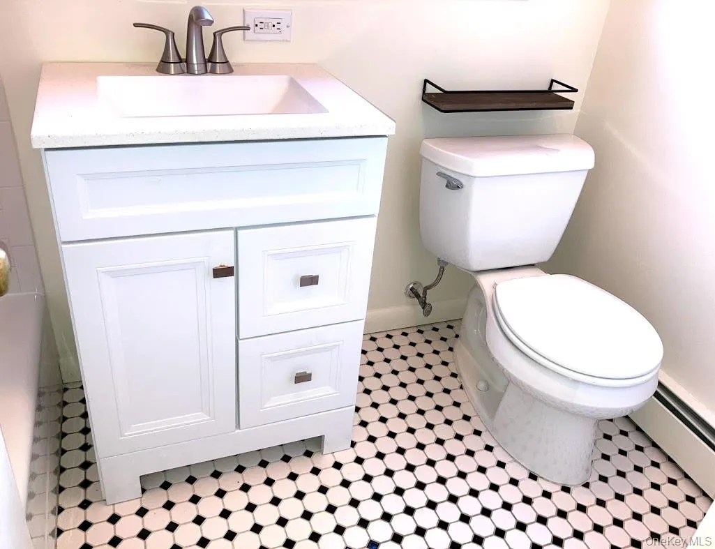 Full Bathroom featuring vanity, and tile patterned floors Full Bathroom featuring vanity, and tile patterned floors