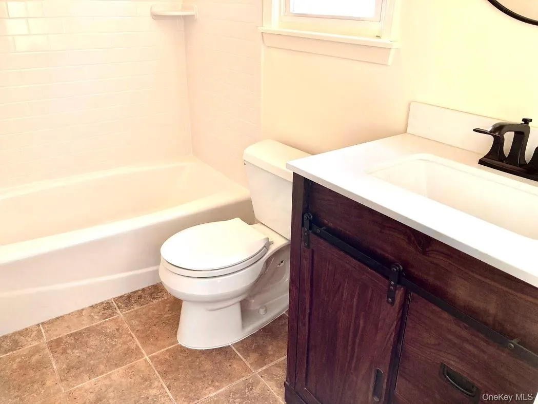 Full Bathroom featuring vanity and shower / bathtub combination Full Bathroom featuring vanity and shower / bathtub combination