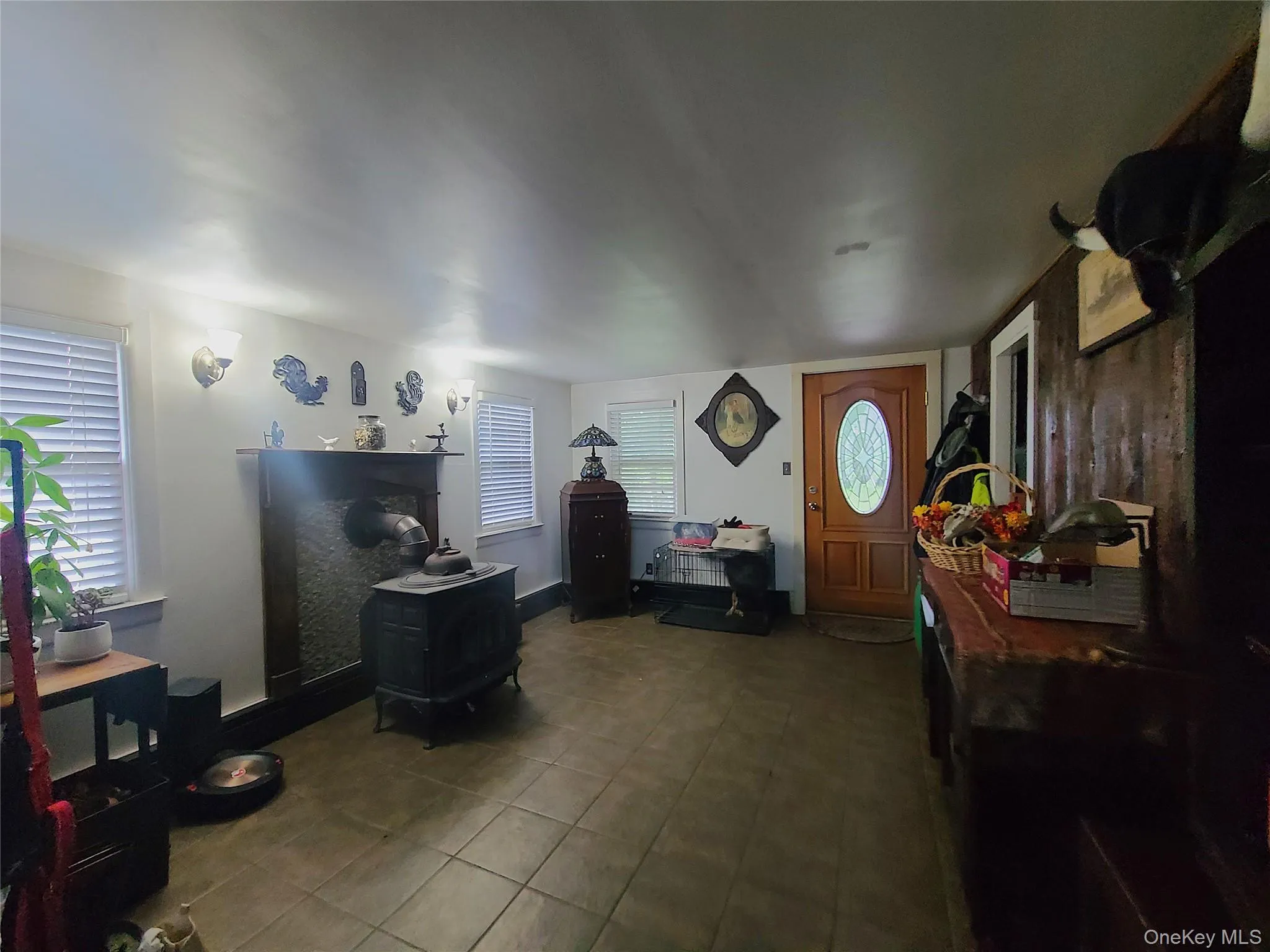 Tiled foyer with a wood stove Tiled foyer with a wood stove