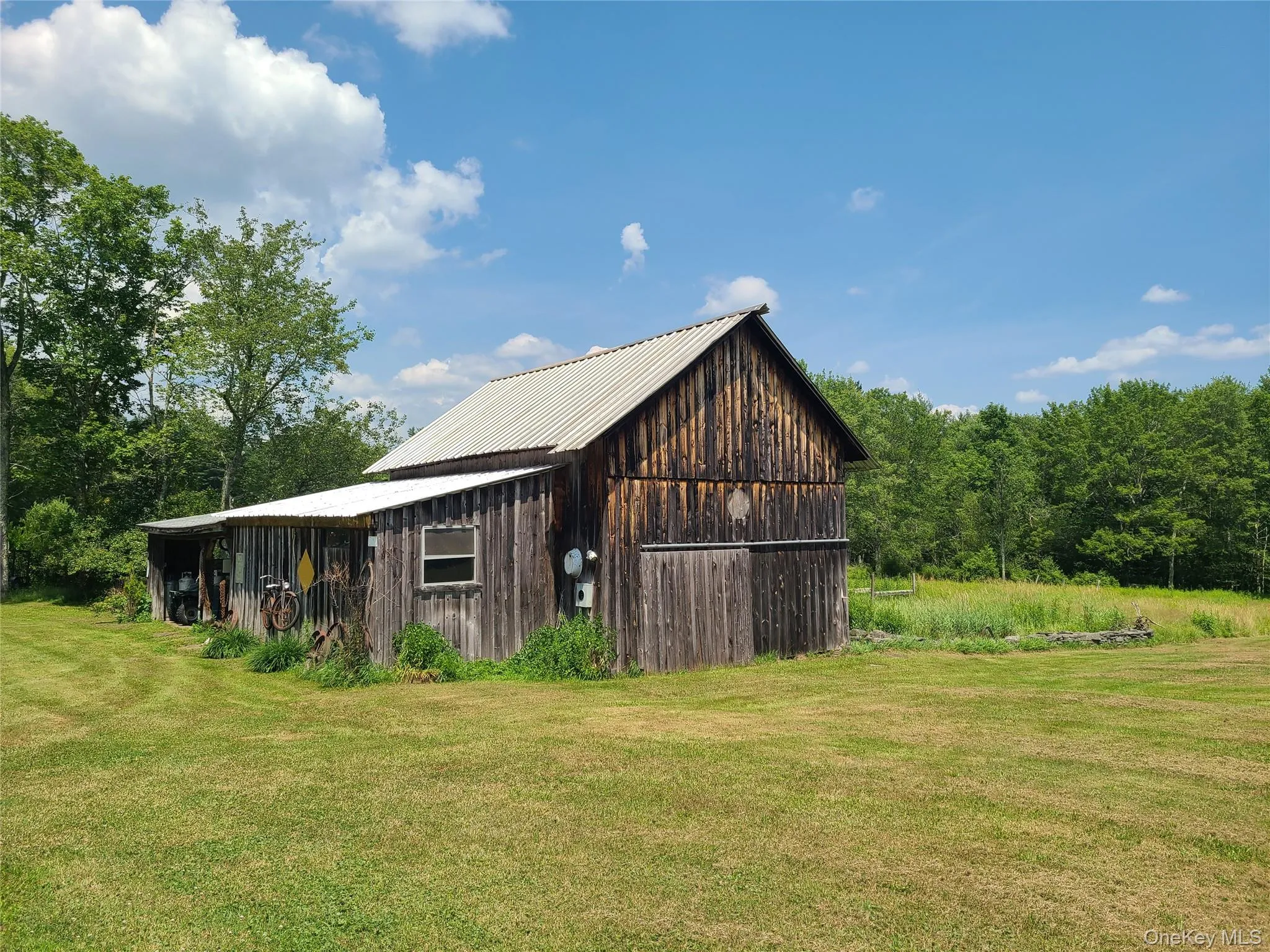 View of barn featuring a yard View of barn featuring a yard