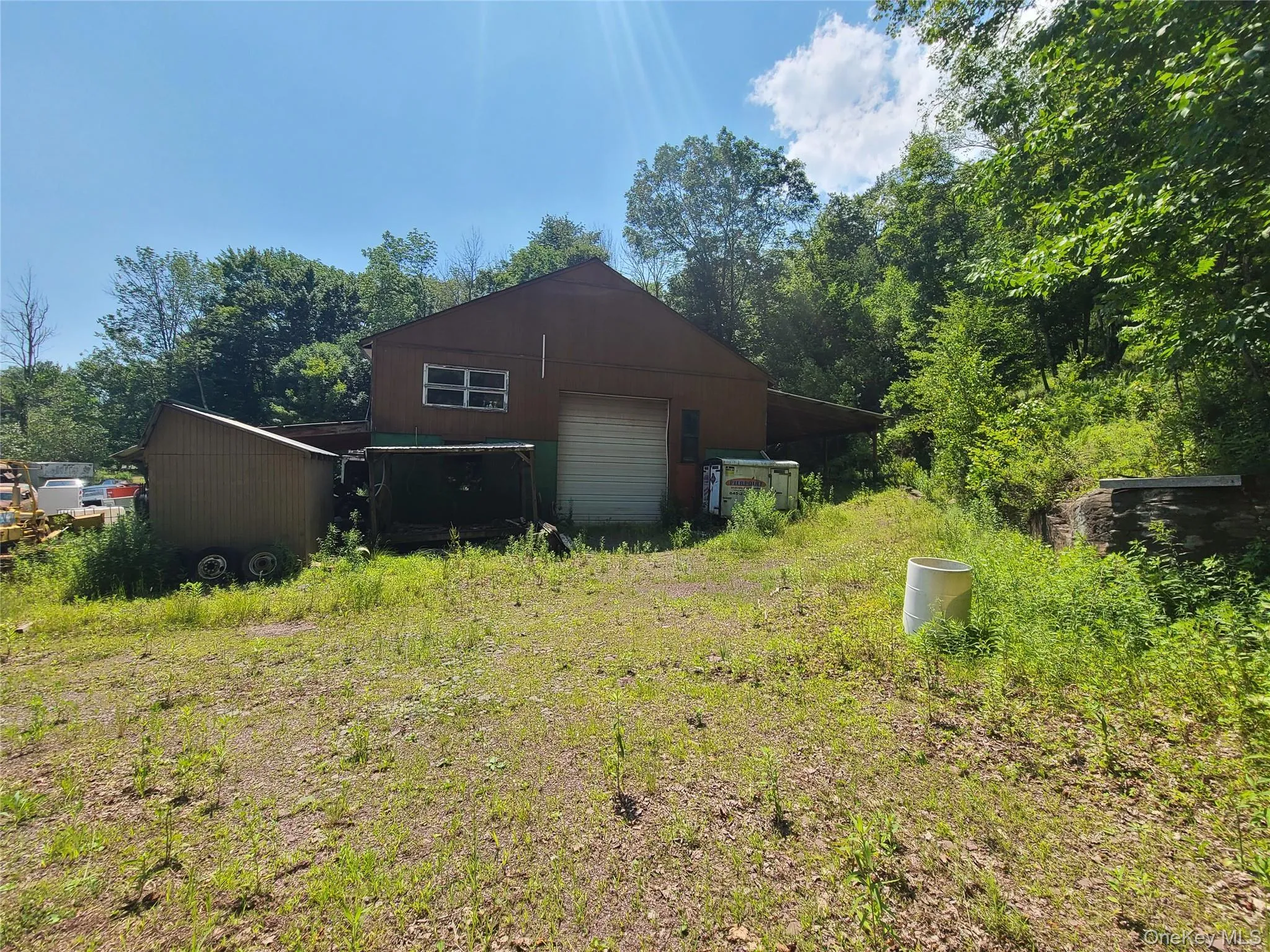 View of side of property with a detached garage View of side of property with a detached garage